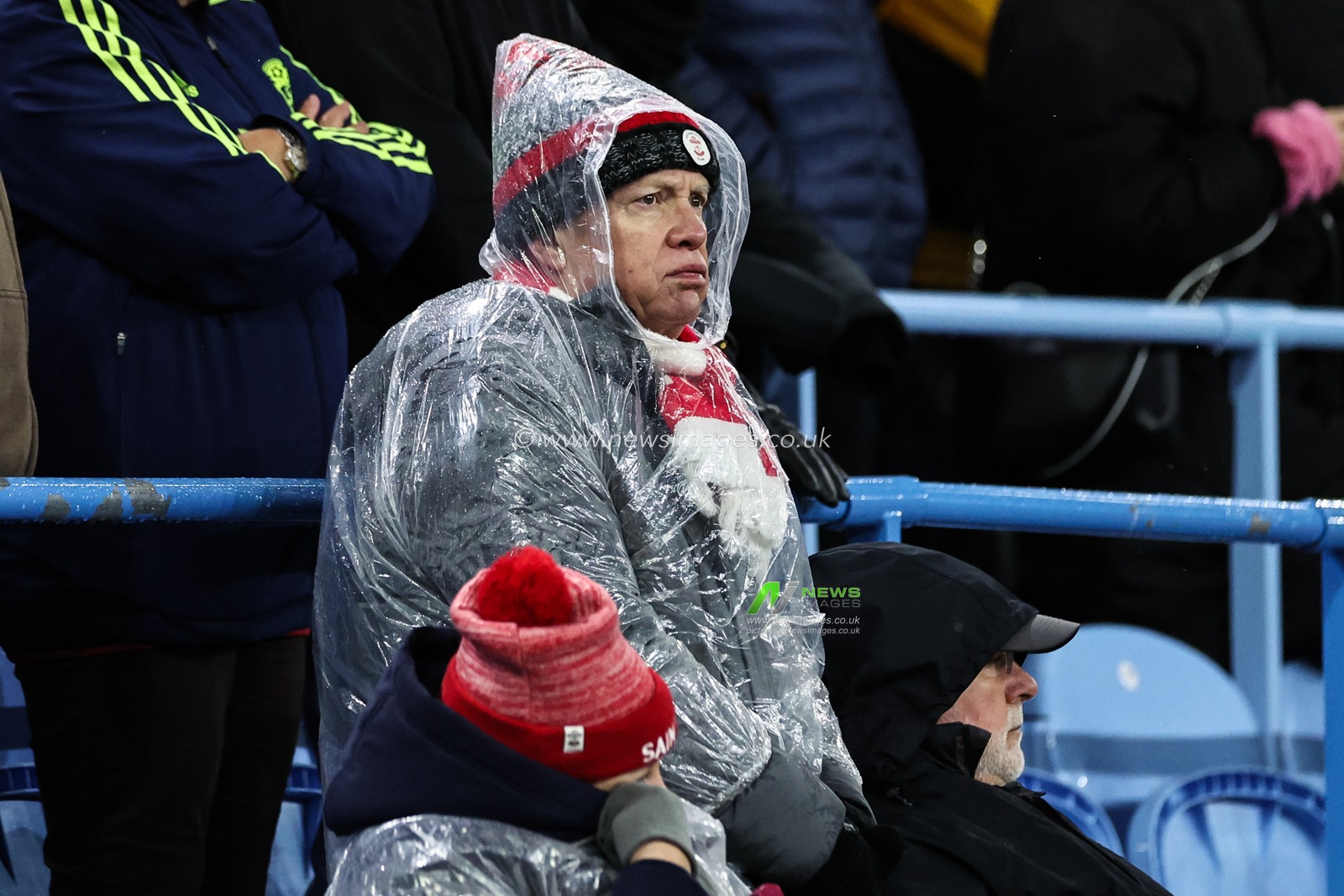 A Southampton fan braves the weather in a poncho during the Premier League match Aston Villa vs Southampton at Villa Park, Birmingham, United Kingdom, 7th December 2024

(Photo by Mark Cosgrove/News Images)