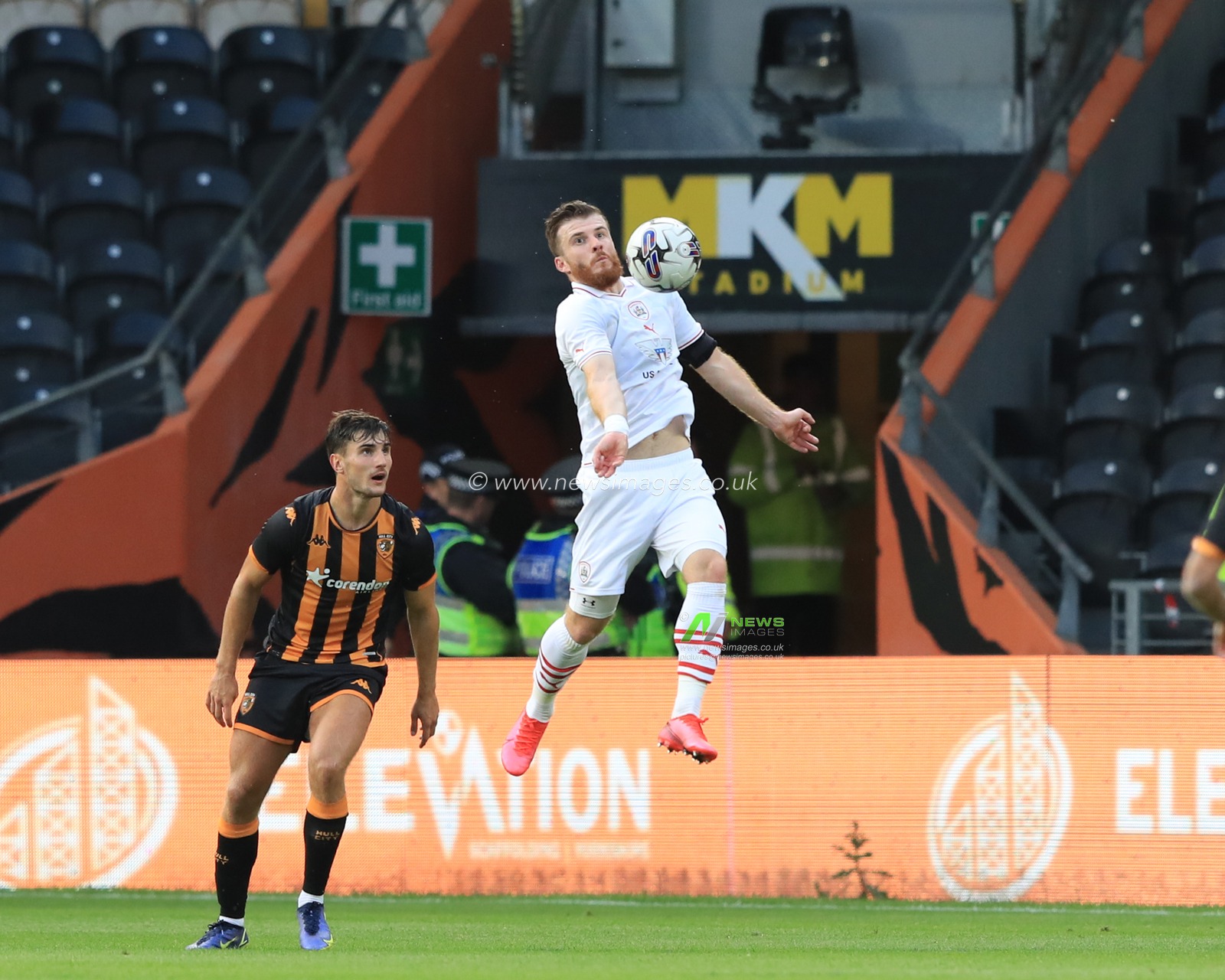 Nicky Cadden #7 of Barnsley jumps up to win the high ball during the Pre-season friendly match Hull City vs Barnsley at MKM Stadium, Hull, United Kingdom, 18th July 2023

(Photo by Alfie Cosgrove/News Images)