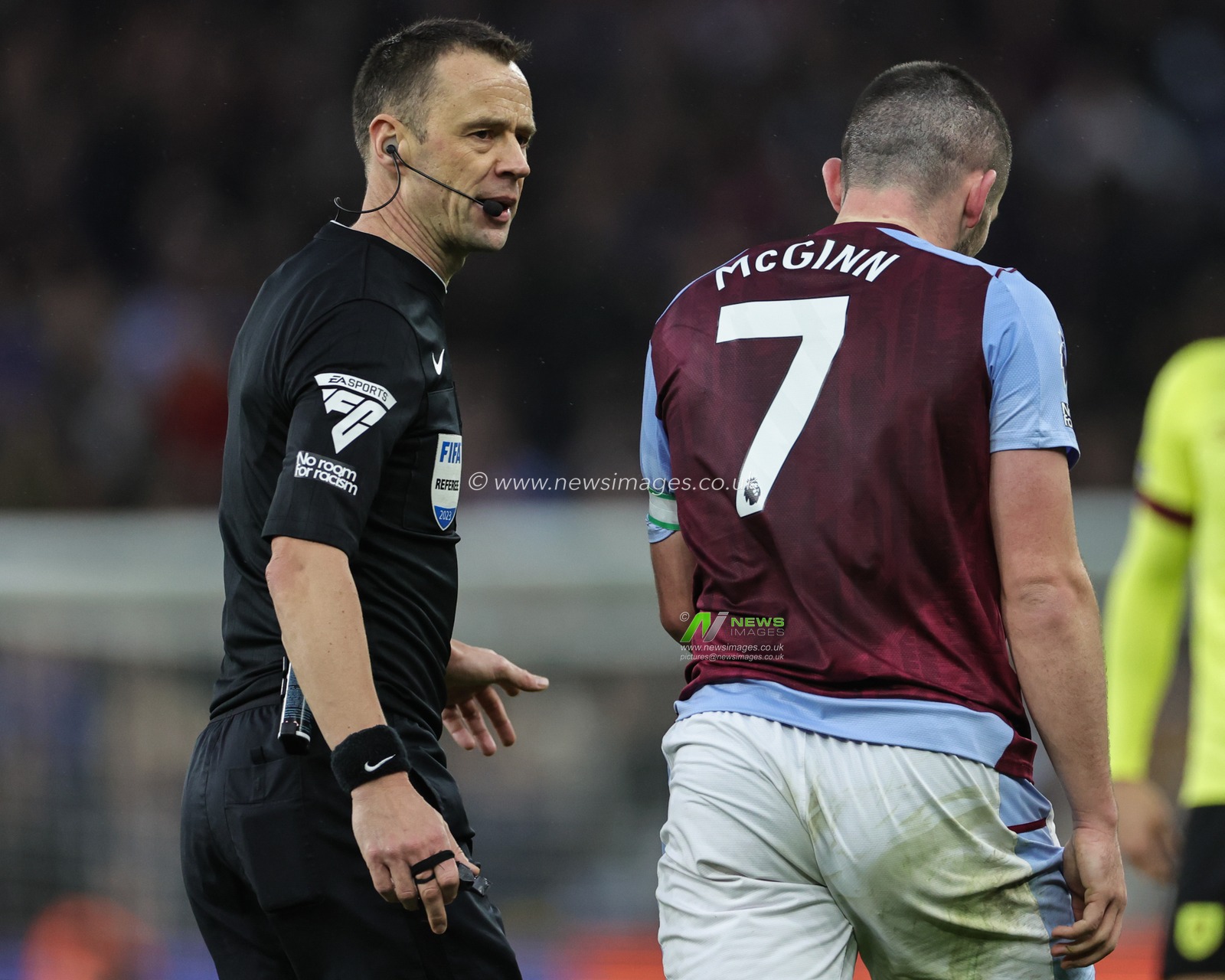 Referee Stuart Attwell has words with John McGinn of Aston Villa during the Premier League match Aston Villa vs Burnley at Villa Park, Birmingham, United Kingdom, 30th December 2023

(Photo by Mark Cosgrove/News Images)