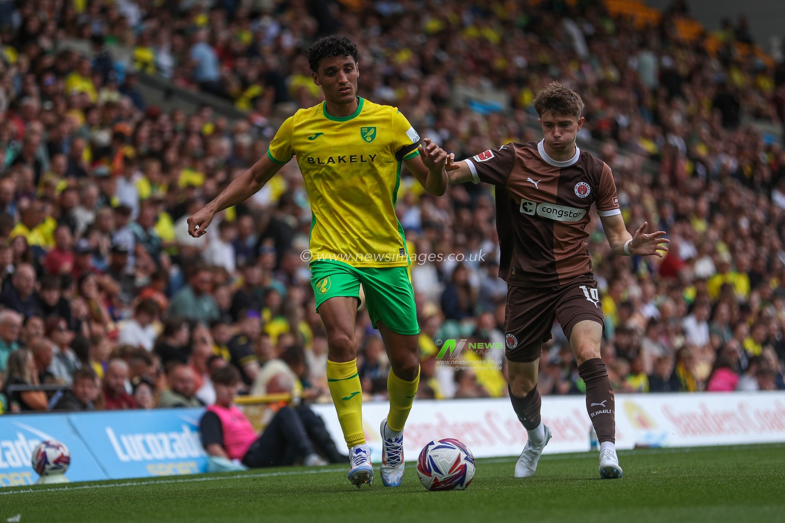 Ben Chrisene of Norwich City is put under pressure by Scott Banks of St Pauli during the Pre-season friendly match Norwich City vs St. Pauli at Carrow Road, Norwich, United Kingdom, 3rd August 2024

(Photo by Izzy Poles/News Images)