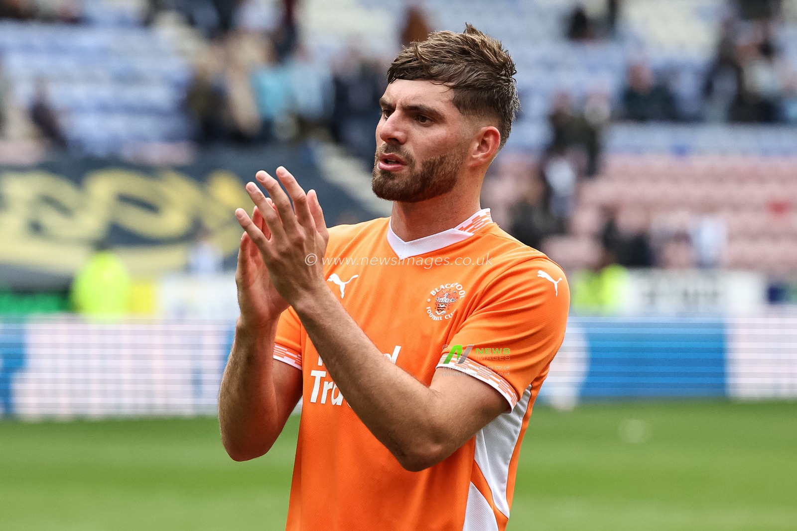 Tom Bloxham of Blackpool applauds the fans after the final whistle during the Sky Bet League 1 match Wigan Athletic vs Blackpool at The Brick Community Stadium, Wigan, United Kingdom, 26th April 2025

(Photo by Mark Cosgrove/News Images)