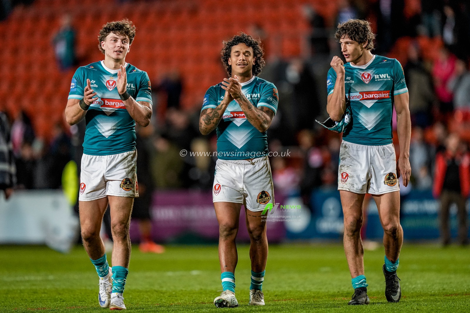 Owen Dagnall of St Helens, Harry Robertson of St Helens and Tristan Sailor of St Helens applaud the fans  during the Betfred Challenge Cup Quarter Final match St Helens vs Catalans Dragons at The BrewDog Stadium, St Helens, United Kingdom on 10 April 2026

(Photo by Maynard Manyowa/News Images)
