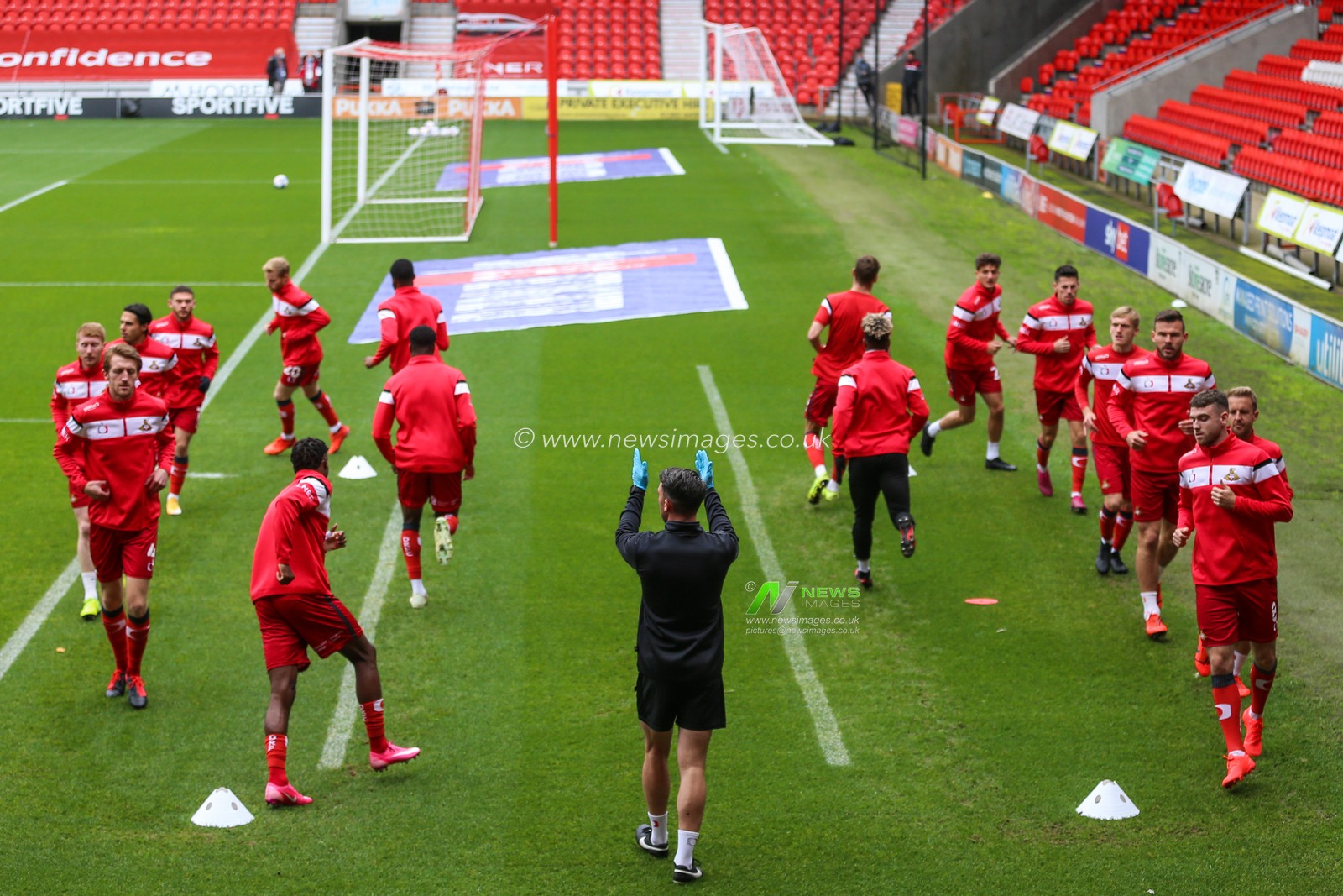 Doncaster Rovers warm up ahead of kick off at the Keepmoat stadium