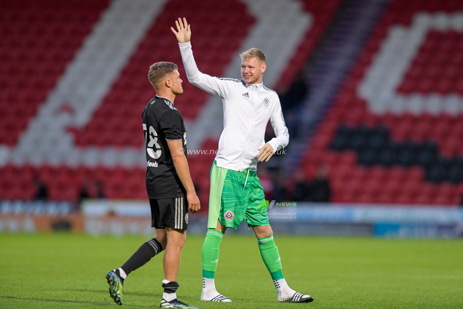 Aaron Ramsdale #1 of Sheffield United waves to the travelling supporters after the final whistle