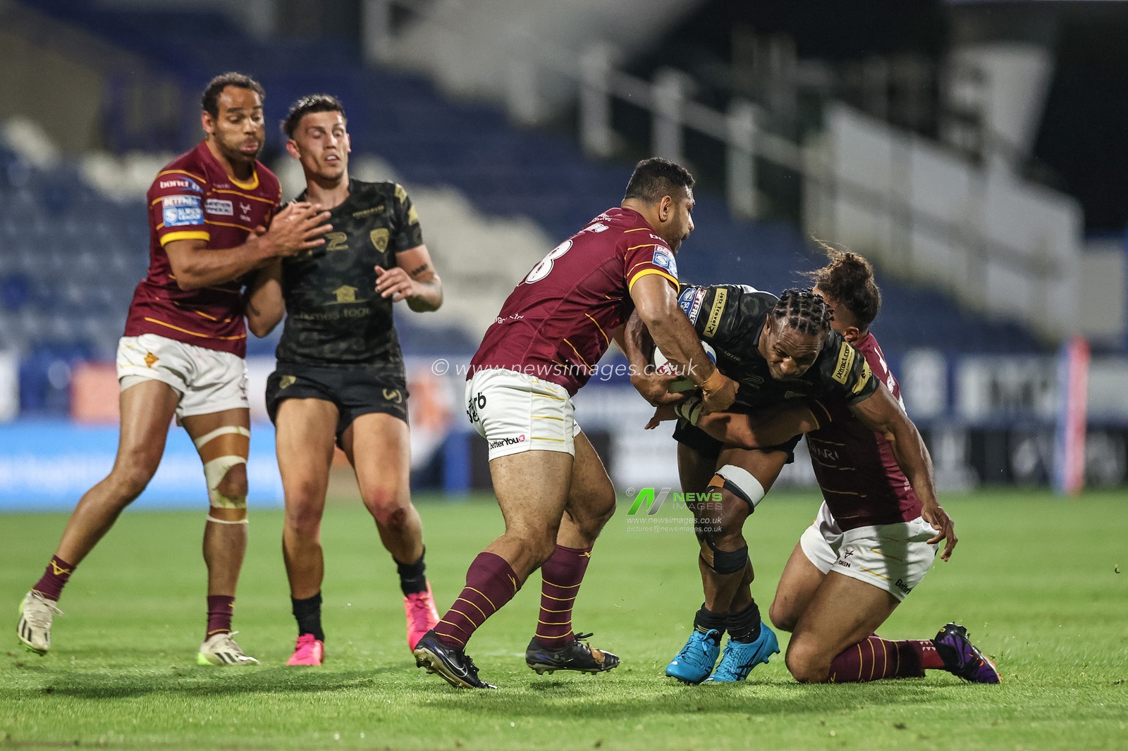 Edwin Ipape of Leigh Leopards is tackled by Ashton Golding of Huddersfield Giants during the Betfred Super League Round 12 match Huddersfield Giants vs Leigh Leopards at John Smith's Stadium, Huddersfield, United Kingdom, 24th May 2024

(Photo by Mark Cosgrove/News Images)