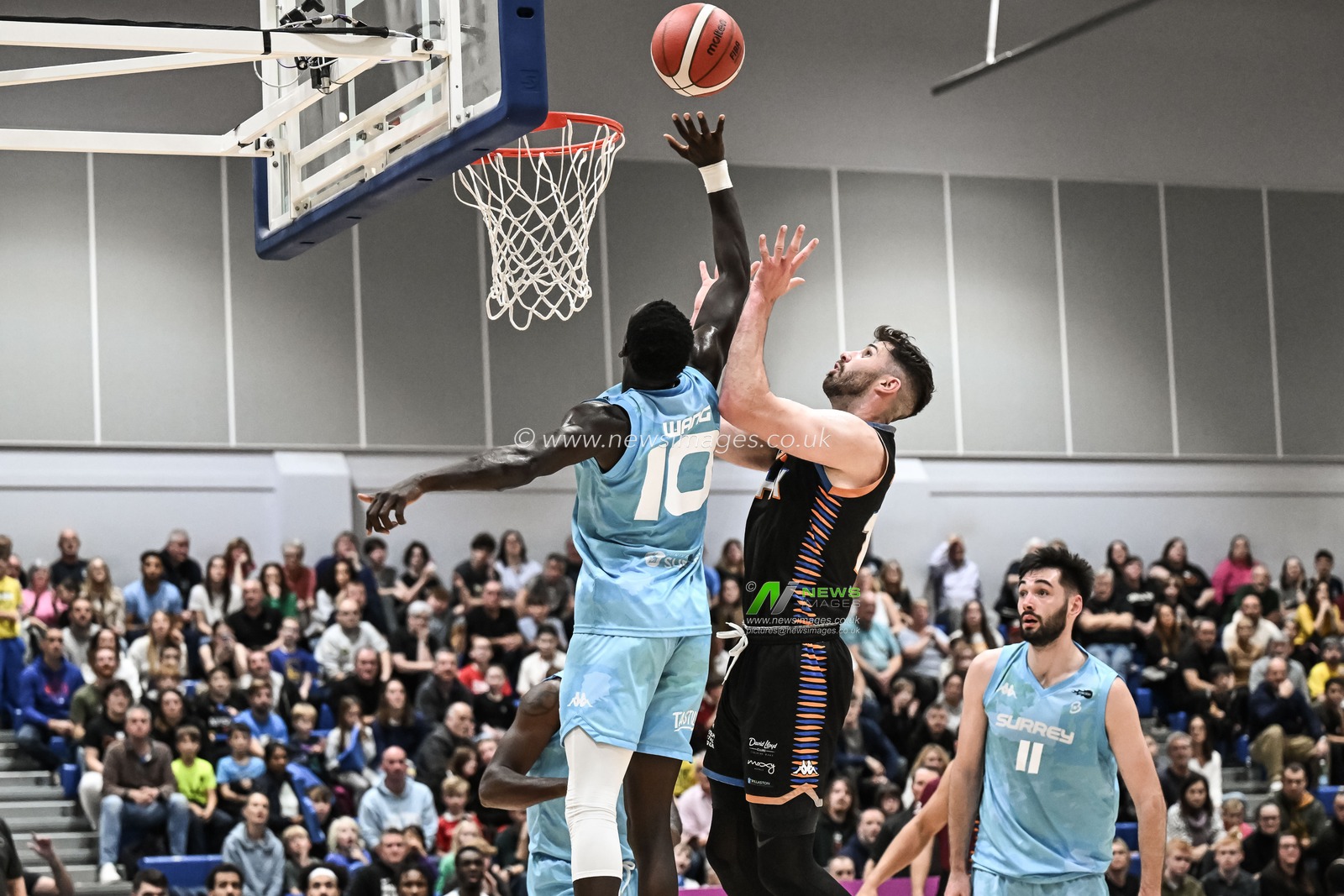 Padiet Wang of Surrey Scorchers knocks David Ulph of Cheshire Phoenix shot away during the British Basketball Championship match Cheshire Phoenix vs Surrey Scorchers at Ellesmere Port Sports Village, Ellesmere Port, United Kingdom, 19th November 2023

(Photo by Craig Thomas/News Images)