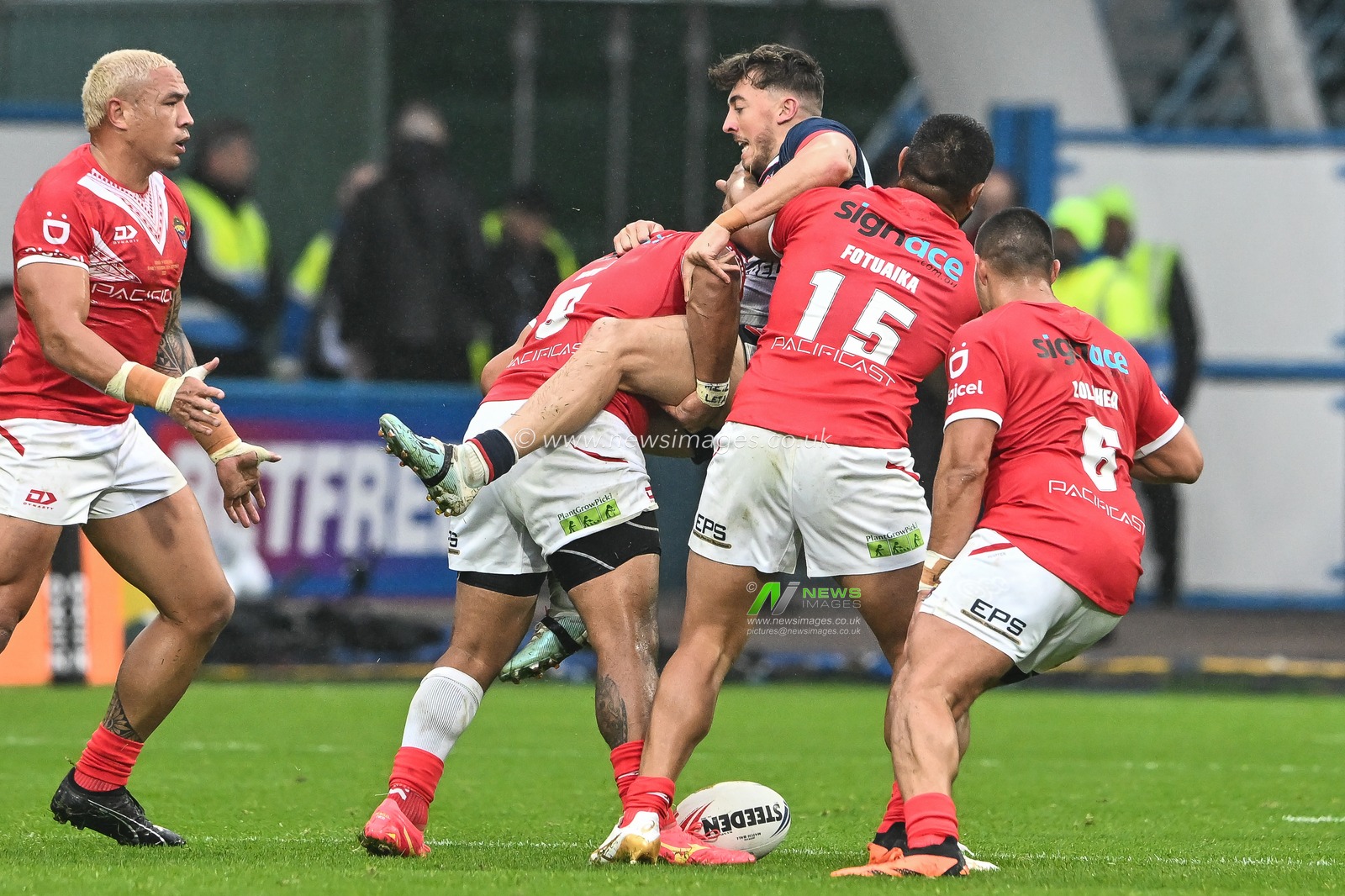 Matty Ashton of England is tackled by Tolutau Koula of Tonga during the Rugby League International match England vs Tonga at John Smith's Stadium, Huddersfield, United Kingdom, 28th October 2023

(Photo by Craig Thomas/News Images)