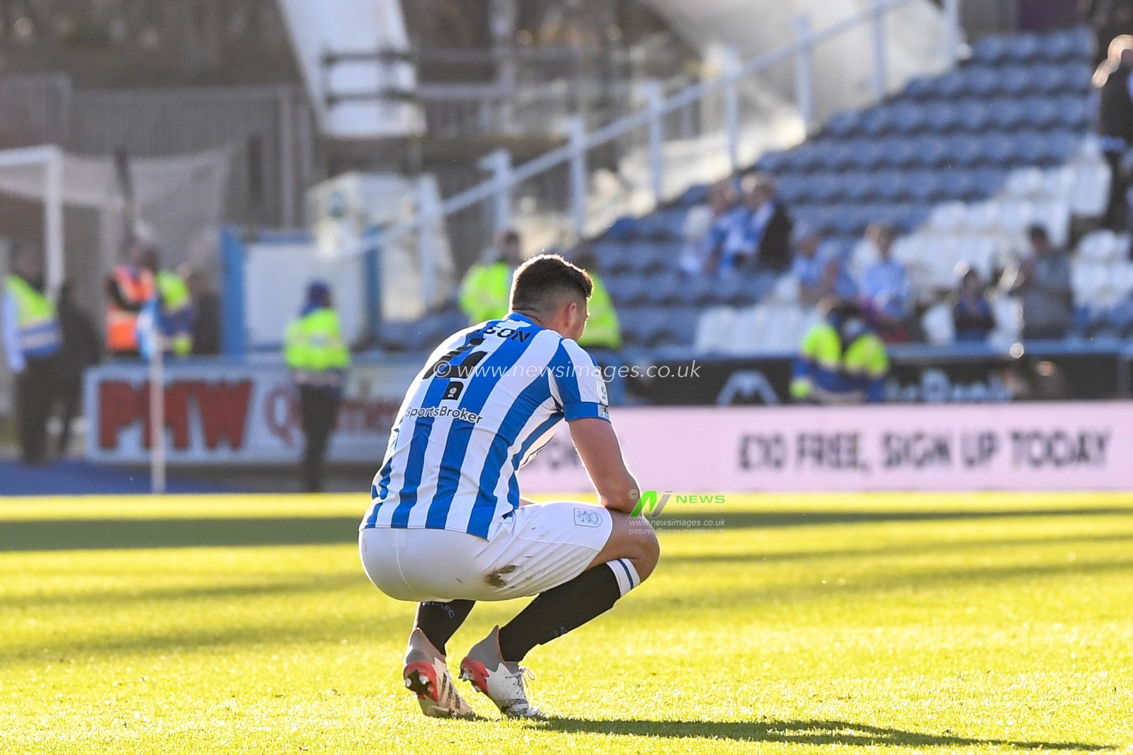 Matty Pearson #4 of Huddersfield Town reacts to losing 0-3 to AFC Bournemouth