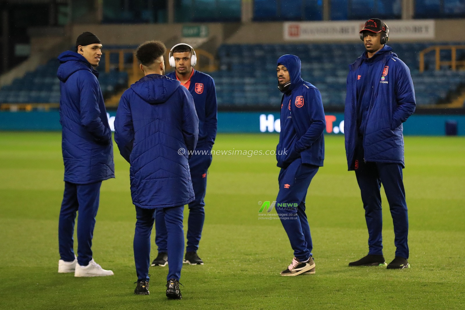 Sorba Thomas #16 of Huddersfield Town joins Jon Russell #37, Tino Anjorin #7, Duane Holmes #19 and Jamal Blackman #18 of Huddersfield Town pre-match.