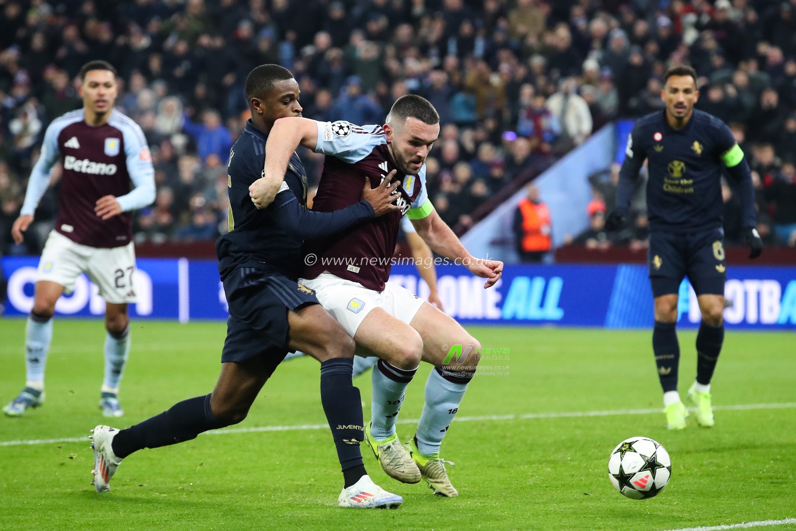 JohnÂ McGinn of Aston Villa holds off Pierre Kalulu of Juventus during the UEFA Champions League,League Phase MD5 match Aston Villa vs Juventus at Villa Park, Birmingham, United Kingdom, 27th November 2024

(Photo by Gareth Evans/News Images)