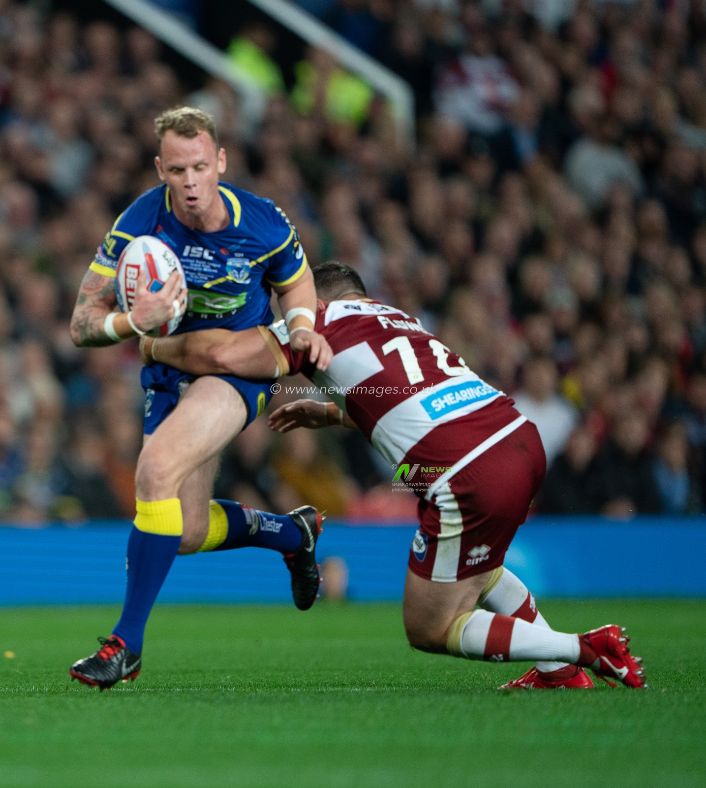 Chris Hill of Warrington Wolves is tackled by Ben Flower of Wigan Warriors 

13th October 2018 , Old Trafford,  Manchester, England;  Betfred Super League Grand Final, Wigan Warriors v Warrington Wolves; 


Terry Donnelly/News Images
