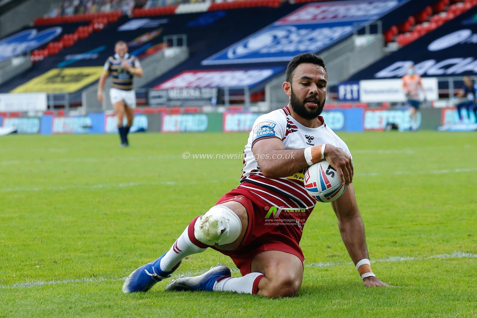 Bevan French (6) of Wigan Warriors scores the try