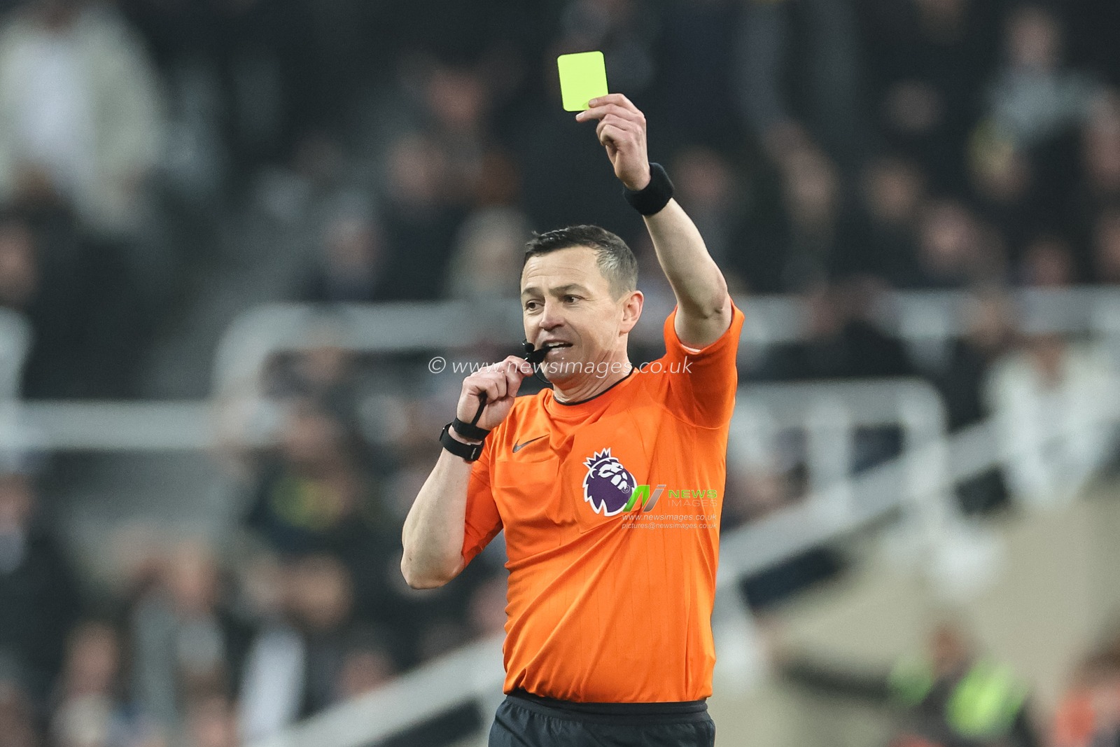 Referee Tony Harrington gives Dwight McNeil of Everton a yellow card during the Premier League match Newcastle United vs Everton at St. James's Park, Newcastle, United Kingdom, 2nd April 2024

(Photo by Mark Cosgrove/News Images)