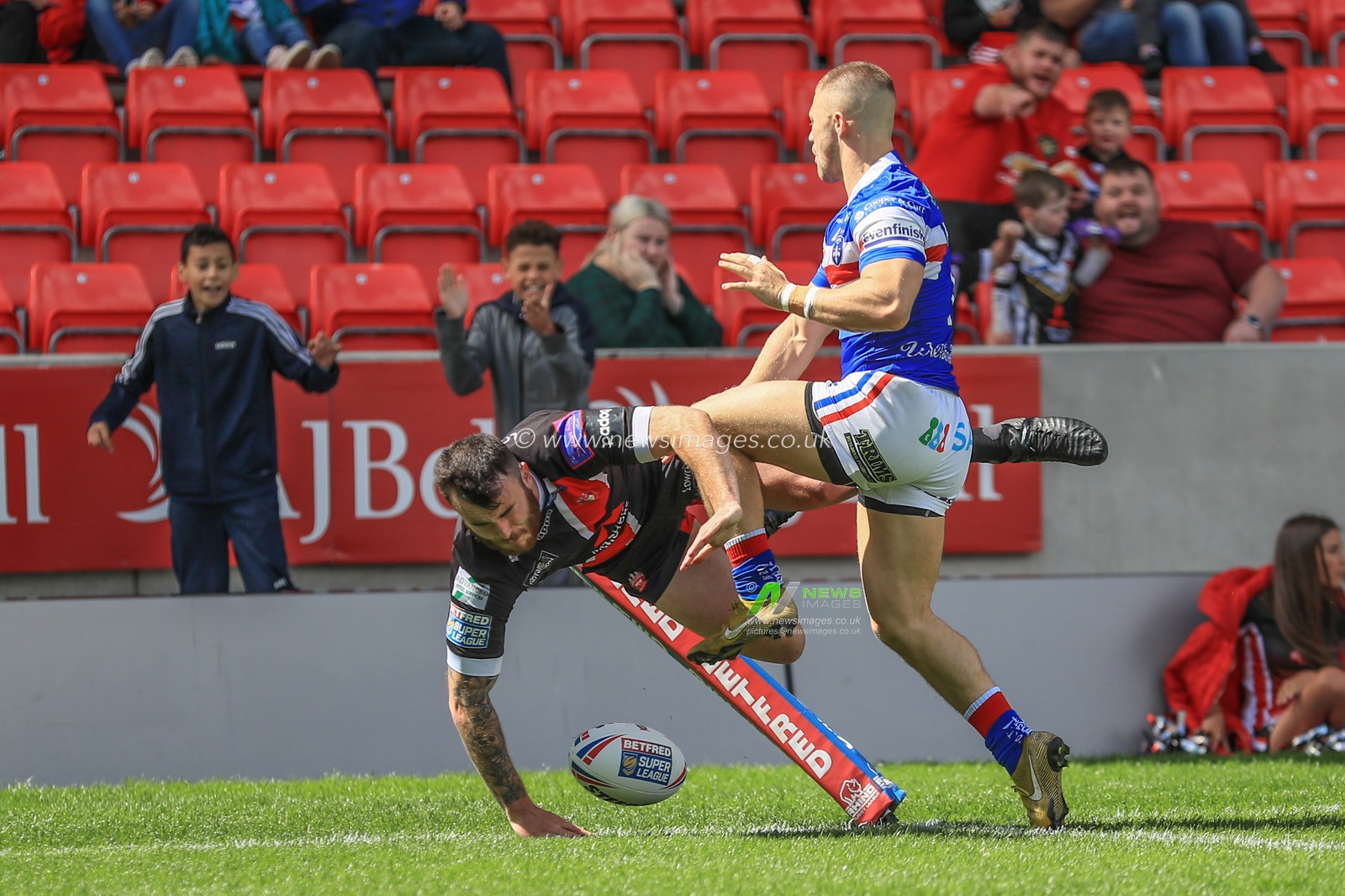 16th June 2019 ,  AJ Bell Stadium, Salford, England;  Betfred Super League, Round 18, Salford Red Devils vs Wakefield Trintiny ; Jake Bibby (5) of Salford Red Devils goes over for his second try 

Credit: Mark Cosgrove/News Images