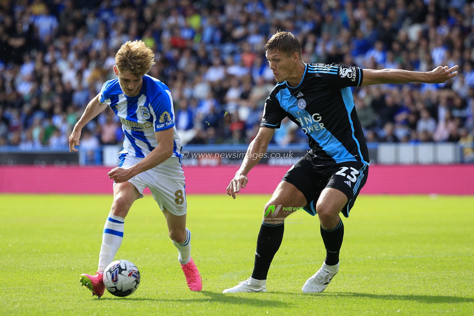 Jack Rudoni #8 of Huddersfield Town tries to get past Jannik Vestergaard #23 of Leicester City during the Sky Bet Championship match Huddersfield Town vs Leicester City at John Smith's Stadium, Huddersfield, United Kingdom, 12th August 2023

(Photo by Conor Molloy/News Images)