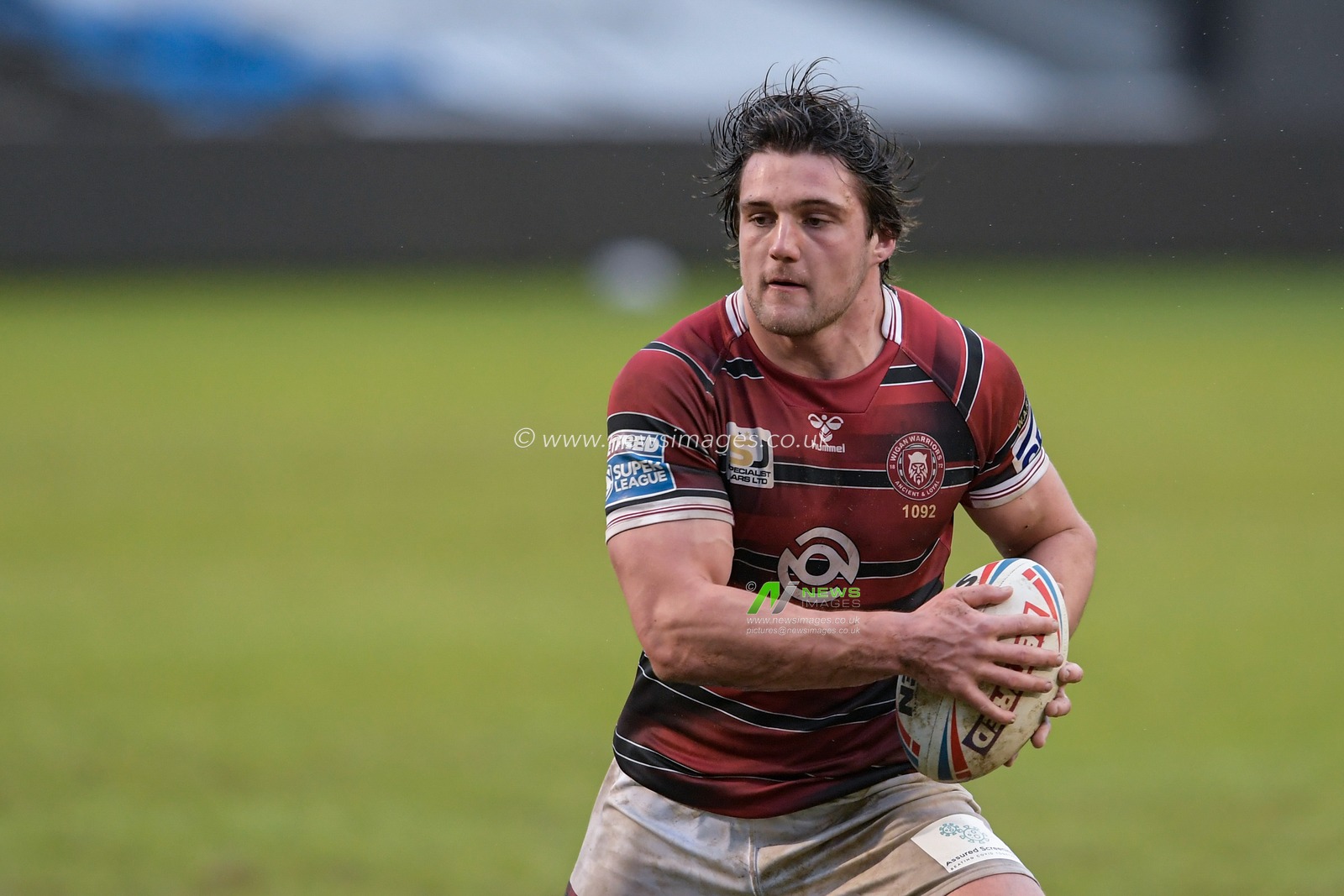 Liam Byrne (19) of Wigan Warriors with the ball