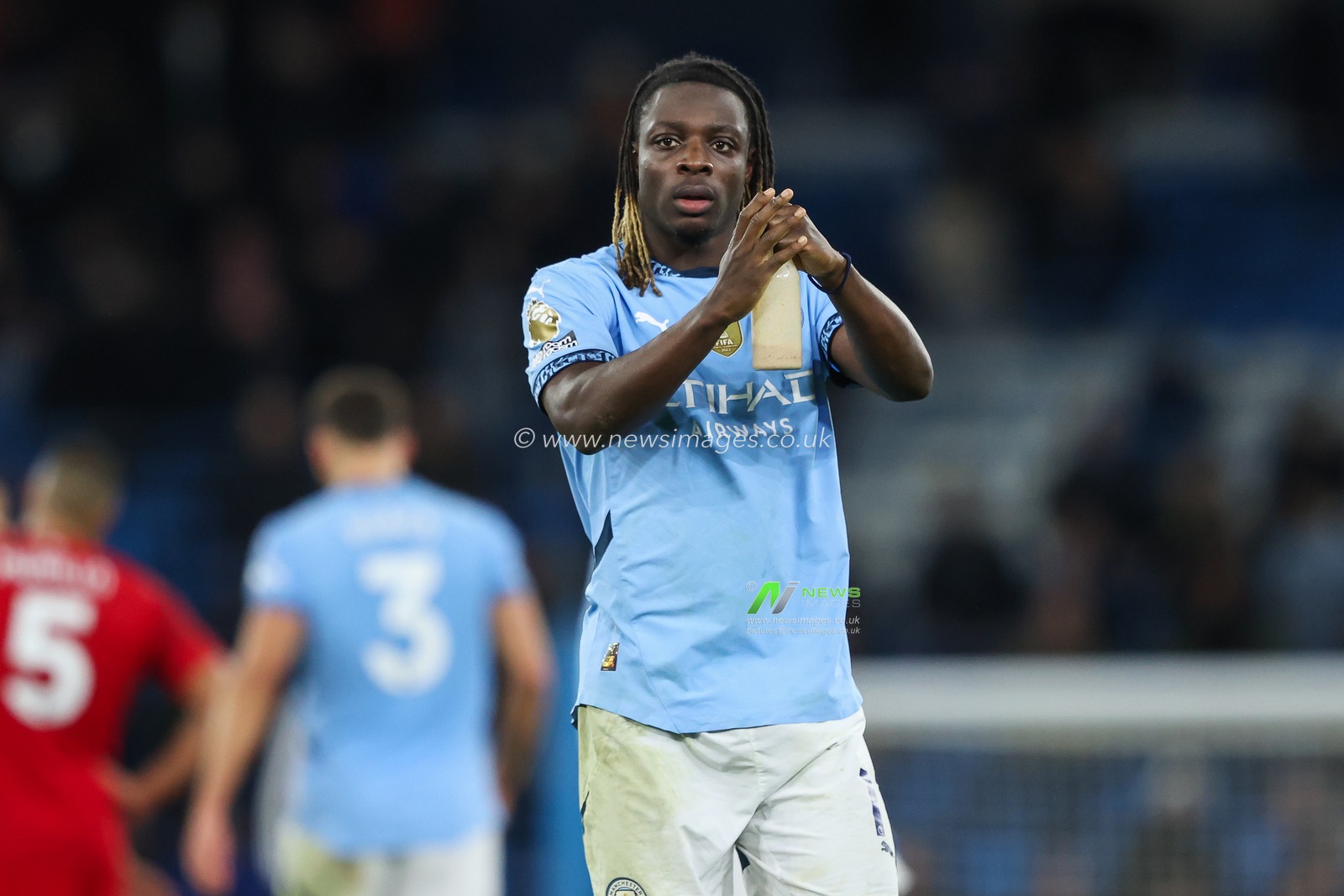 JÃ©rÃ©my Doku of Manchester City applauds the fans at the end of the Premier League match Manchester City vs Nottingham Forest at Etihad Stadium, Manchester, United Kingdom, 4th December 2024

(Photo by Alfie Cosgrove/News Images)