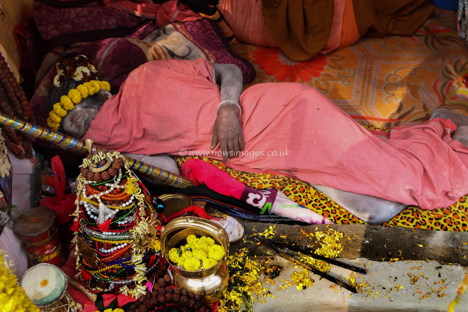 A Naga saint sleeped at a transit camp of the Gangasagar fair in Kolkata, India, on January 9, 2025. The Gangasagar Mela is an annual Hindu festival held at Gangasagar, West Bengal, where the Ganges River meets the Bay of Bengal. The fair takes place at Kapilmuni's ashram on Gangasagar every year on Makar Sankranti.Pictures by Debajyoti Chakraborty.(Photo: Debajyoti Chakraborty/News Images)