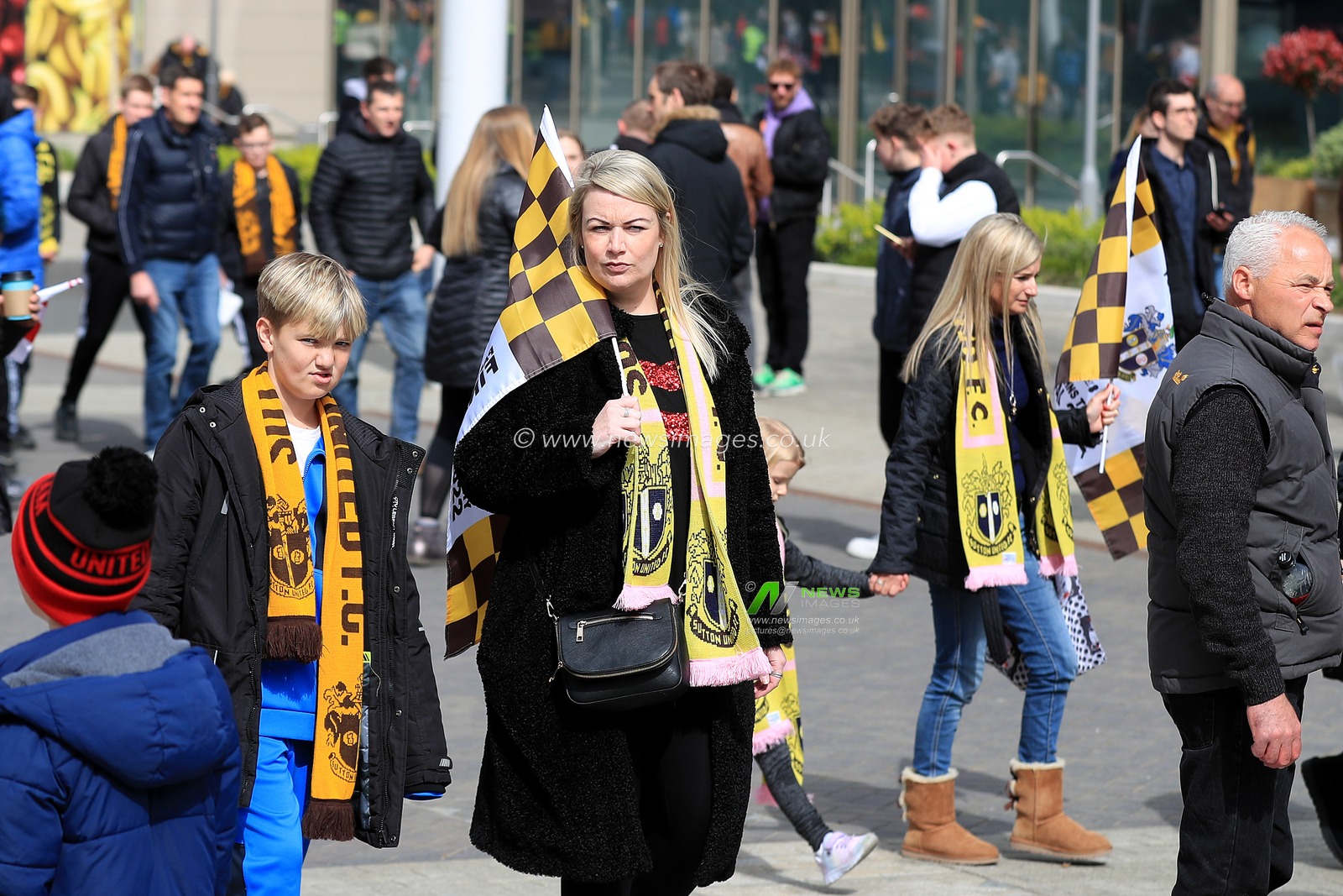 Sutton United fans with scarves and flags prior to kick off.