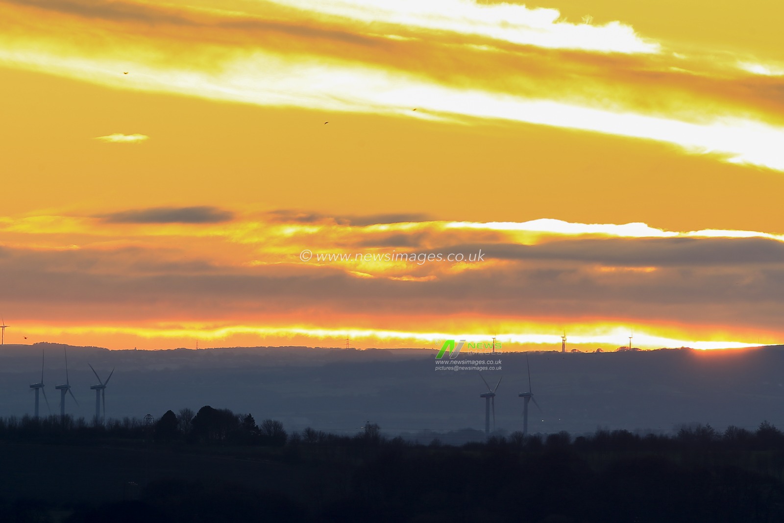 The final sunset of 2020 as the sun disappears behind Gateshead, as shot from Cleadon Hills in South Shields.