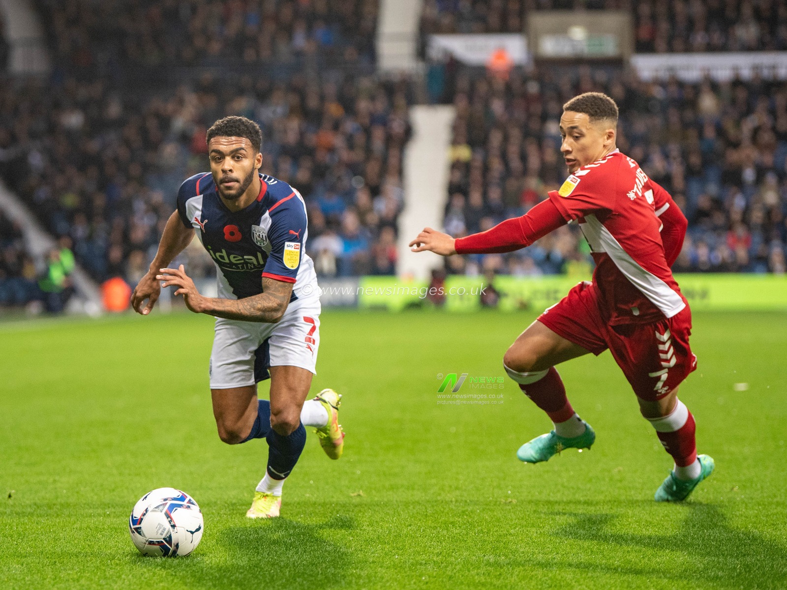 Darnell Furlong #2 of West Bromwich Albion takes the ball past Marcus Tavernier #7 of Middlesbrough to cross the ball