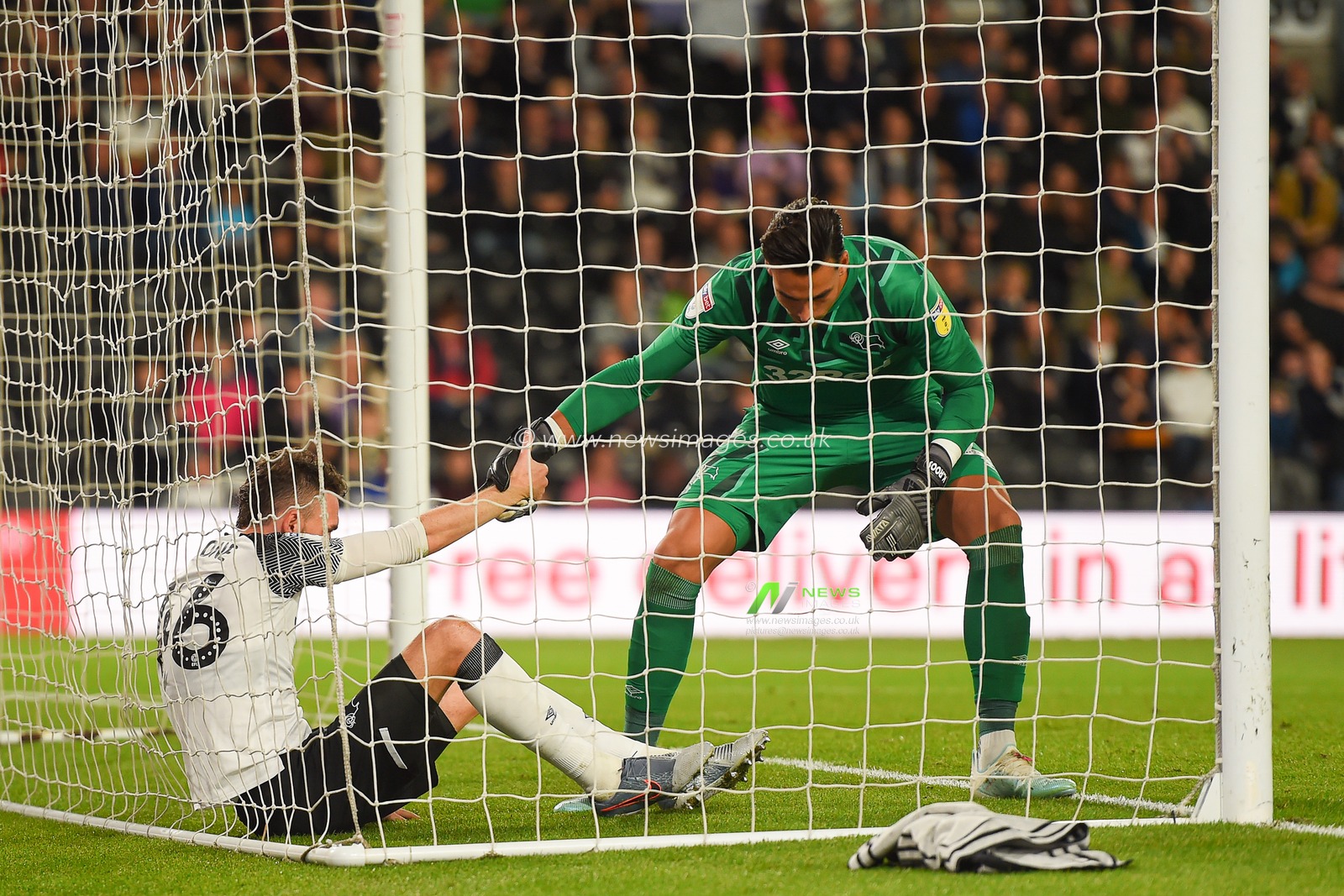 13th September 2019, Pride Park, Derby, England; Sky Bet Championship Football, Derby County vs Cardiff City ; Kelle Roos (21) of Derby County helps Scott Malone (46) of Derby County 

Credit: Jon Hobley/News Images 

English Football League images are subject to DataCo Licence