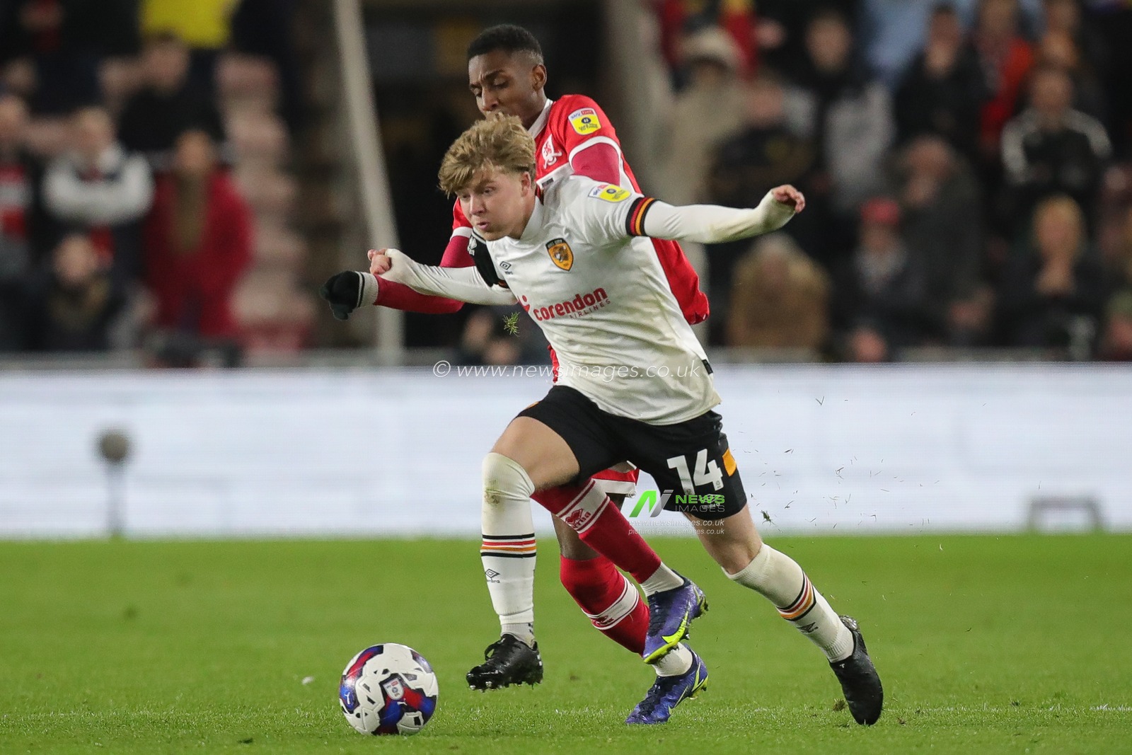 Isaiah Jones #2 of Middlesbrough and Harry Vaughan #14 of Hull City battle for the ball during the Sky Bet Championship match Middlesbrough vs Hull City at Riverside Stadium, Middlesbrough, United Kingdom, 19th April 2023

(Photo by James Heaton/News Images)
