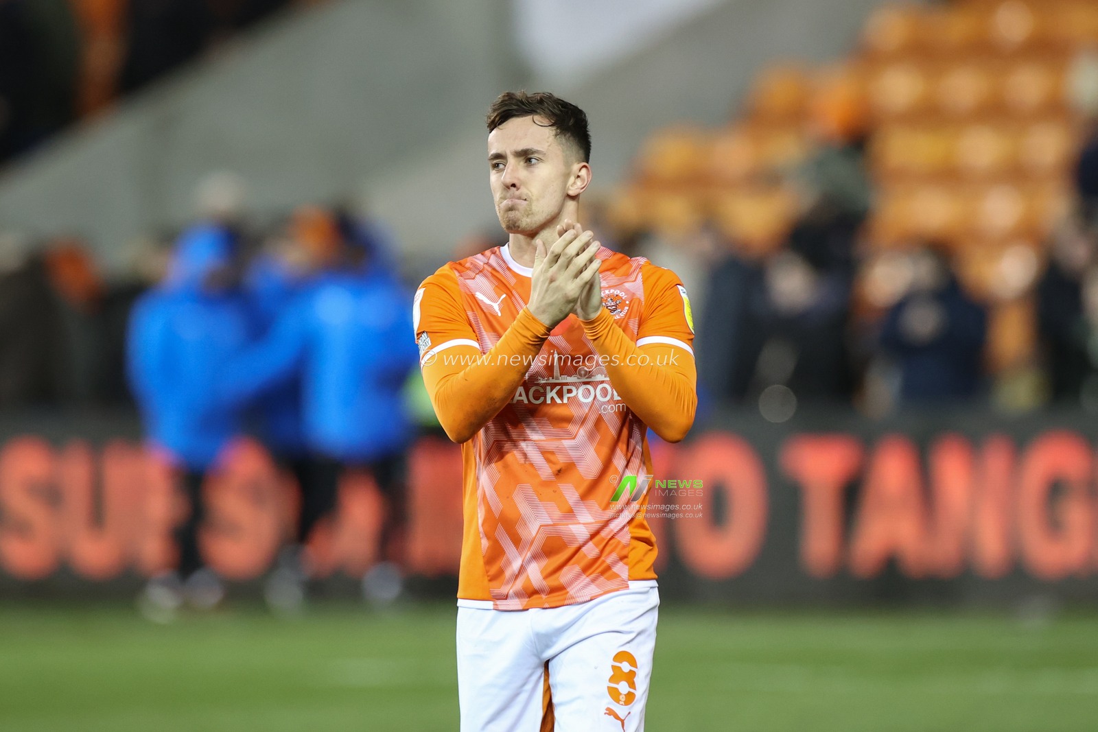 Ryan Wintle #8 of Blackpool applauds the fans