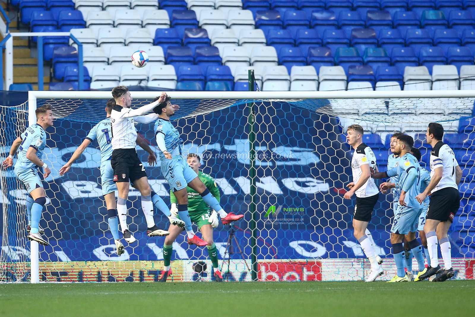 Jamie Lindsay #16 of Rotherham United and Tyler Walker #19 of Coventry City compete for the ball following a corner