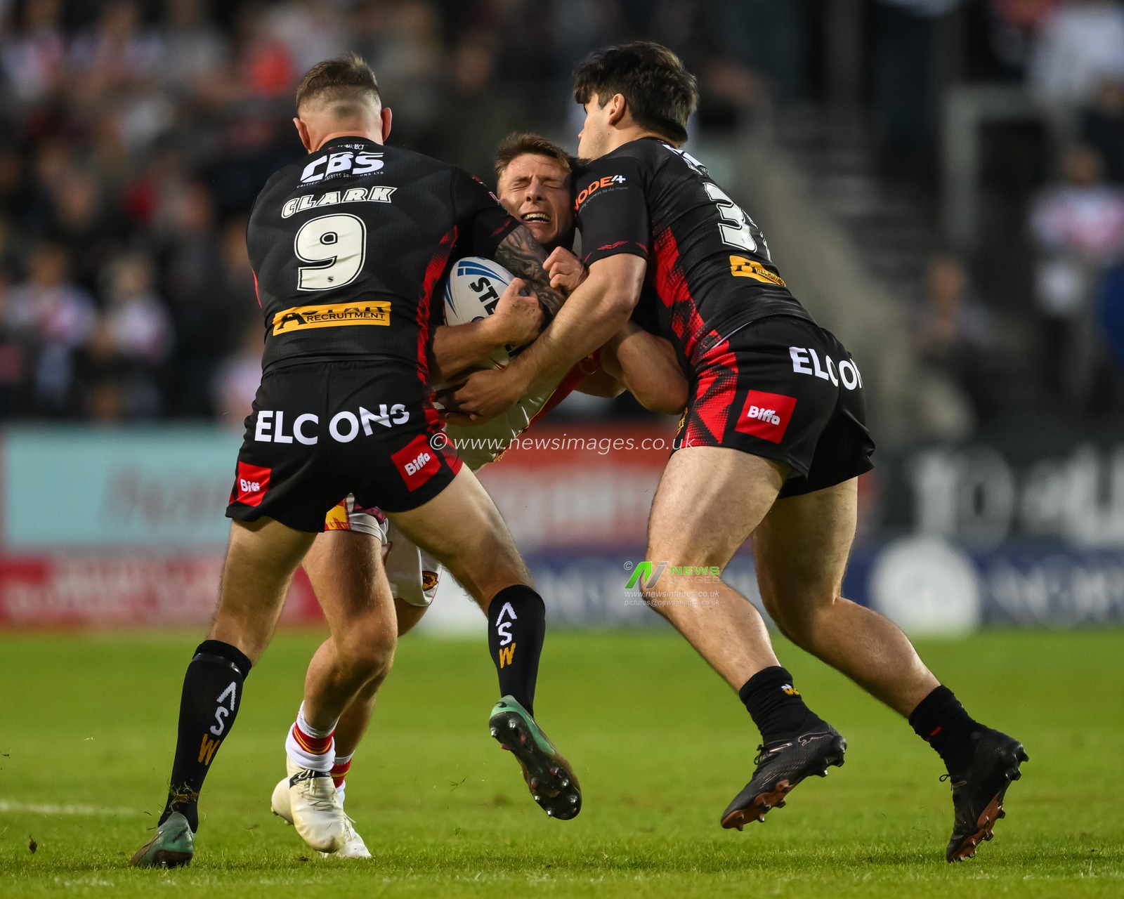 Tom Davies of Catalan Dragons is tackled by Daryl Clark of St. Helens and Noah Stephens of St. Helens  during the Betfred Super League Round 13 match St Helens vs Catalans Dragons at Totally Wicked Stadium, St Helens, United Kingdom, 31st May 2024

(Photo by Craig Thomas/News Images)