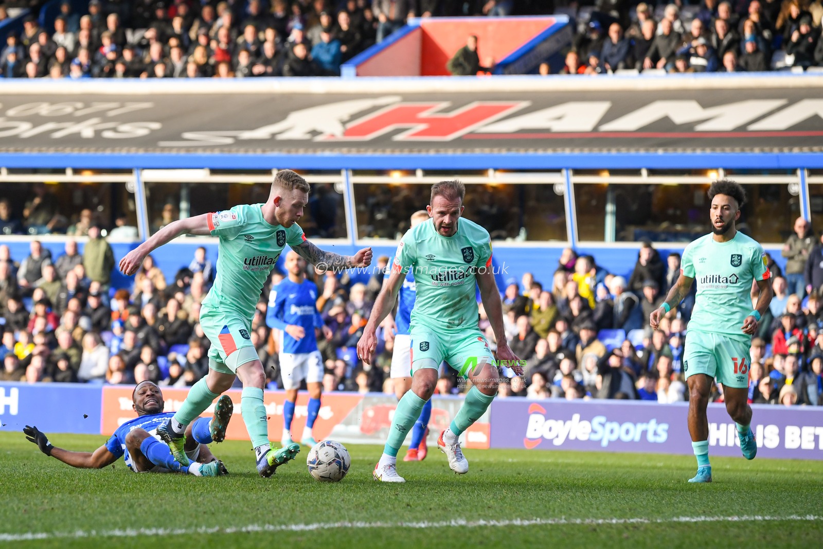 Lewis O'Brien #8 of Huddersfield Town scores a goal to make it 0-2
