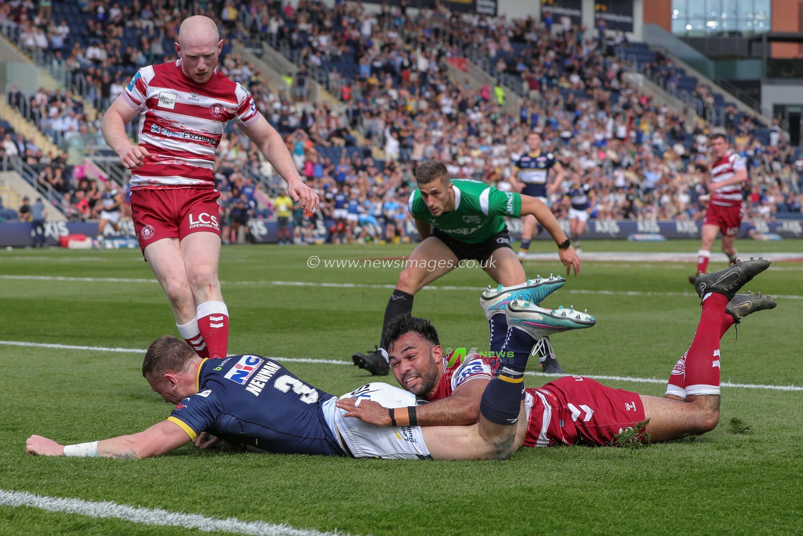 Harry Newman #3 of Leeds Rhinos goes over for a try and makes the score 12-0 in the first half of the Betfred Challenge Cup match Leeds Rhinos vs Wigan Warriors at Headingley Stadium, Leeds, United Kingdom, 20th May 2023

(Photo by James Heaton/News Images)