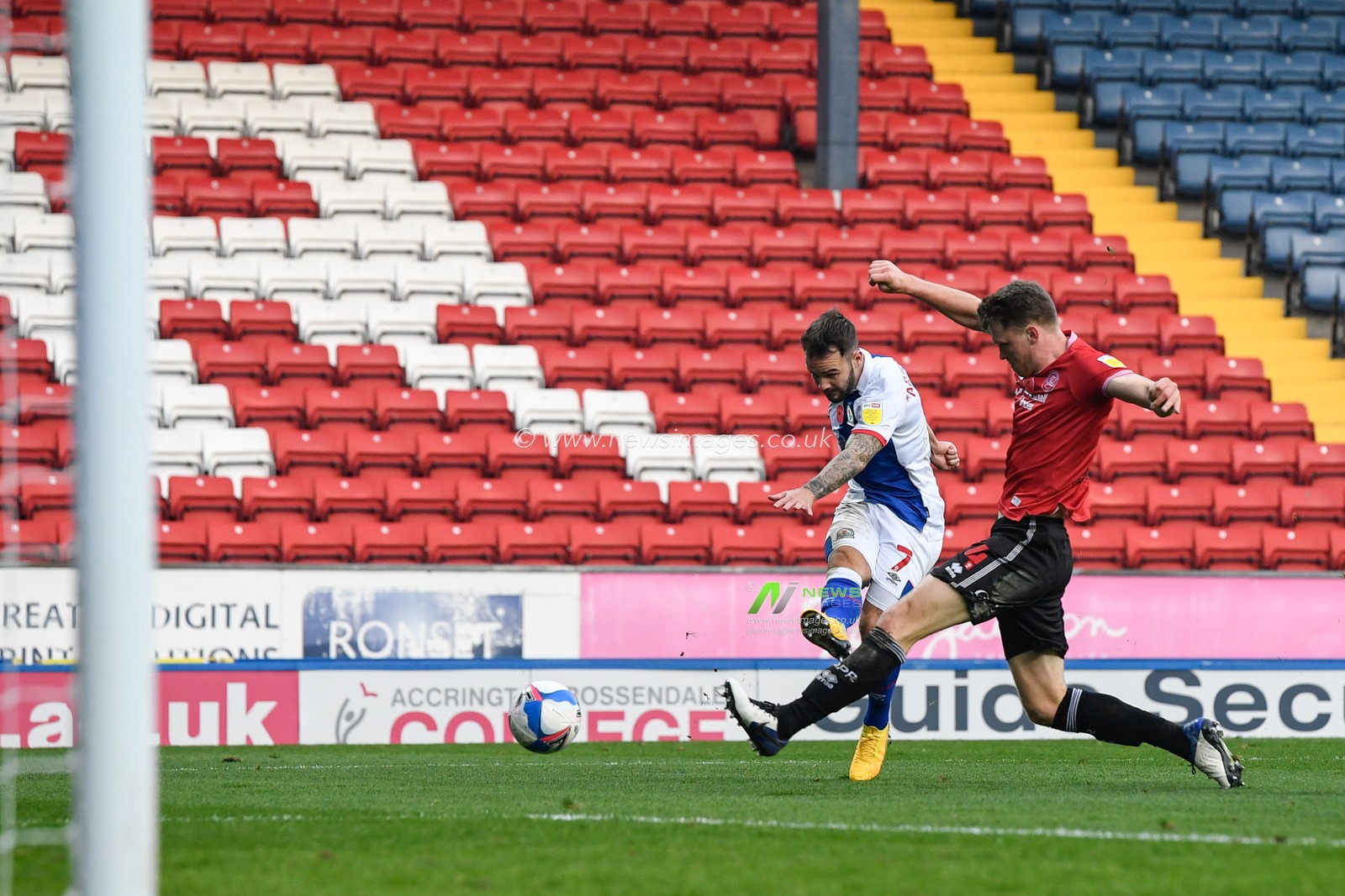 Adam Armstrong #7 of Blackburn Rovers has a shot at goal while under pressure from Rob Dickie #4 of Queens Park Rangers