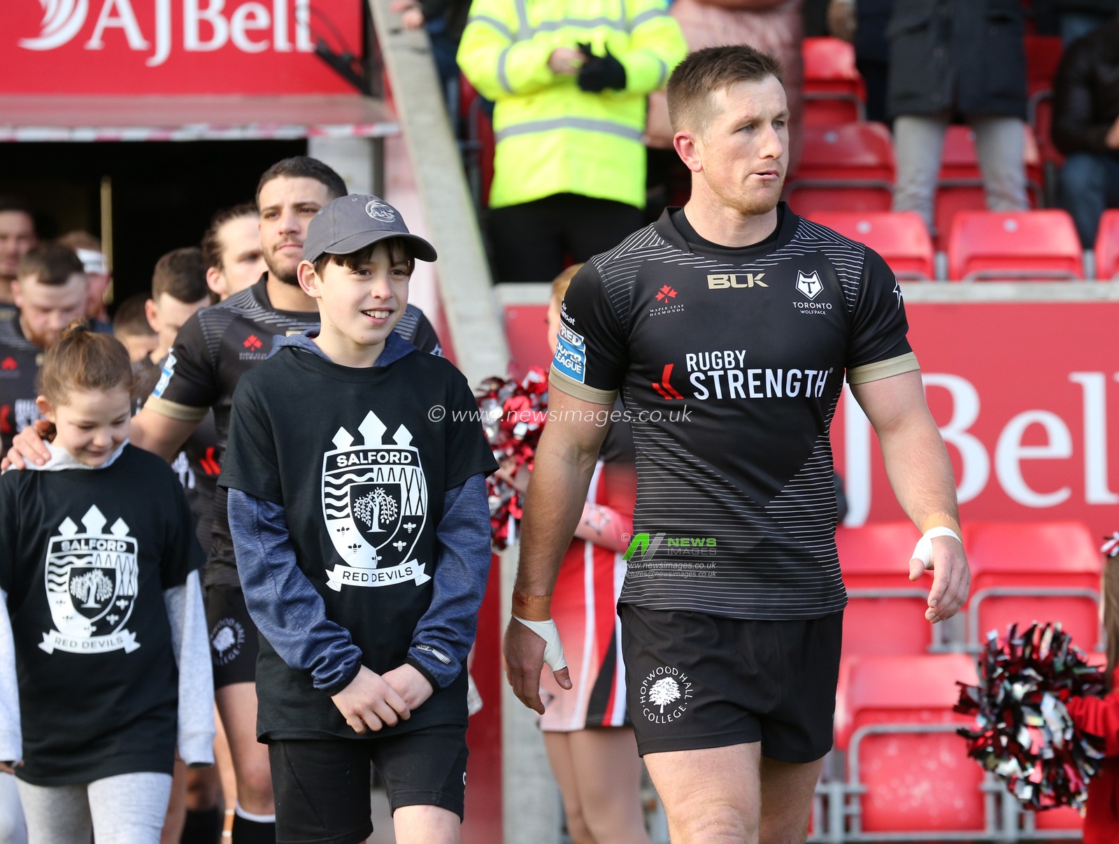 8th February 2020, AJ Bell Stadium, Eccles, England; Betfred Super League, Salford Red Devils v Toronto Wolfpack : Josh McCrone of Toronto Wolfpack leads out the team against Salford Red Devils.