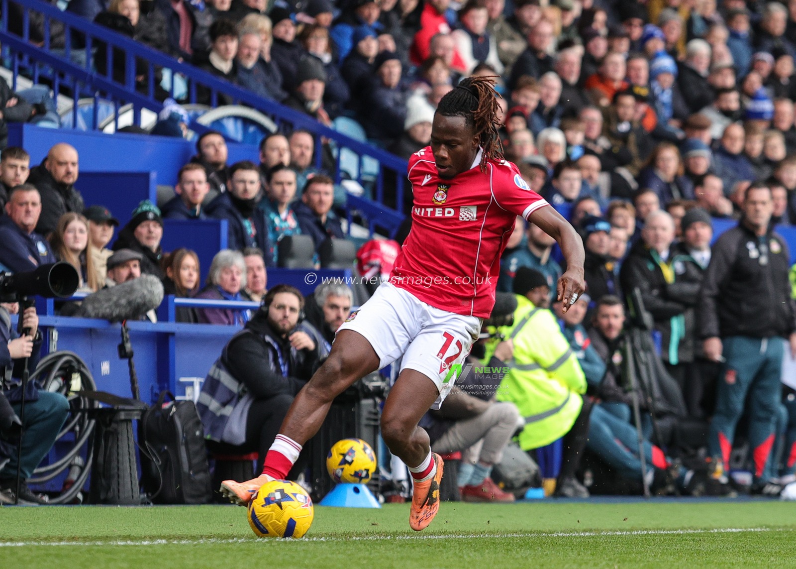 Issa Kabore of Wrexham tries to keep ball in play during the Sky Bet Championship match Sheffield Wednesday vs Wrexham at Hillsborough, Sheffield, United Kingdom, 31st January 2026

(Photo by Richard Bierton/News Images)