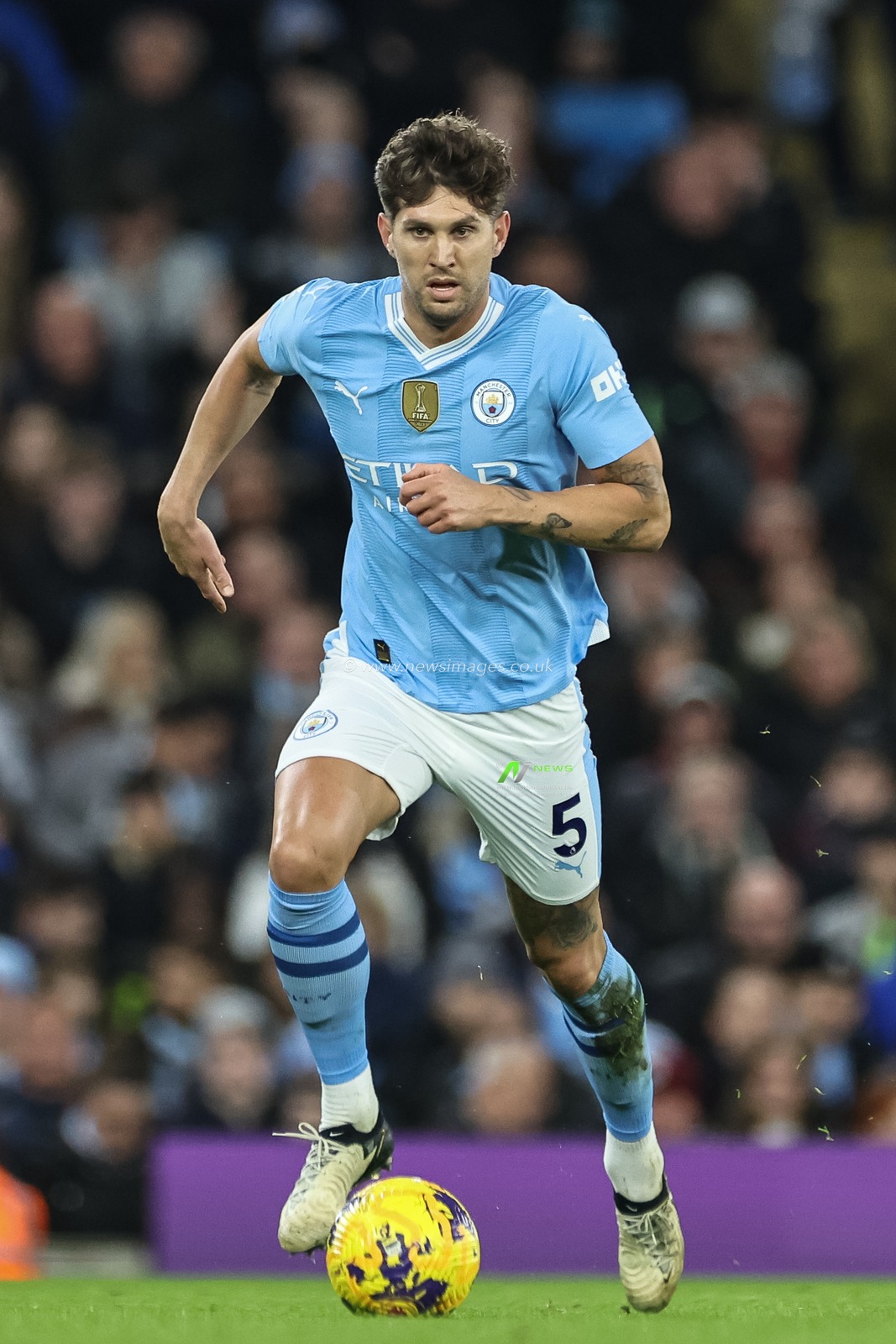 John Stones of Manchester City breaks with the ball during the Premier League match Manchester City vs Brentford at Etihad Stadium, Manchester, United Kingdom, 20th February 2024

(Photo by Mark Cosgrove/News Images)
