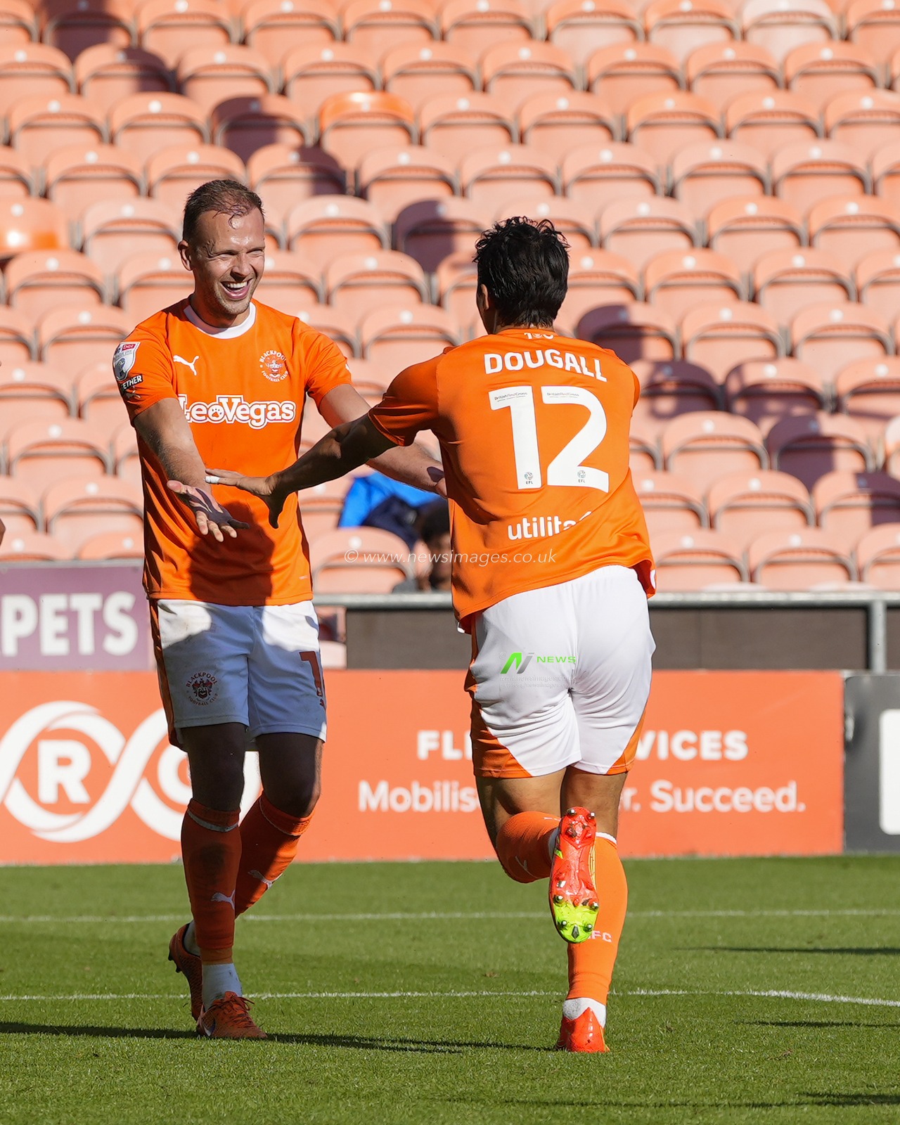 Jordan Rhodes #16 of Blackpool celebrates with goalscorer Kenny Dougall #12 of Blackpool after heâ€™d score3d too make it 2-1 during the Sky Bet League 1 match Blackpool vs Wigan Athletic at Bloomfield Road, Blackpool, United Kingdom, 2nd September 2023

(Photo by Steve Flynn/News Images)