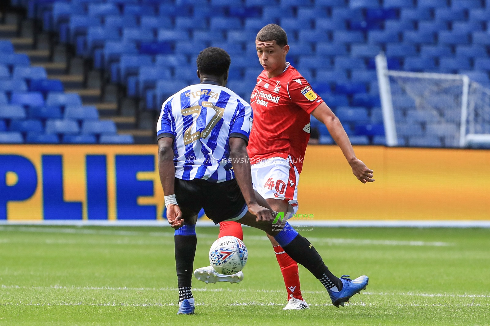 Brennan Johnson (40) of Nottingham Forest nutmegs Dominic Iorfa (27) of Sheffield Wednesday