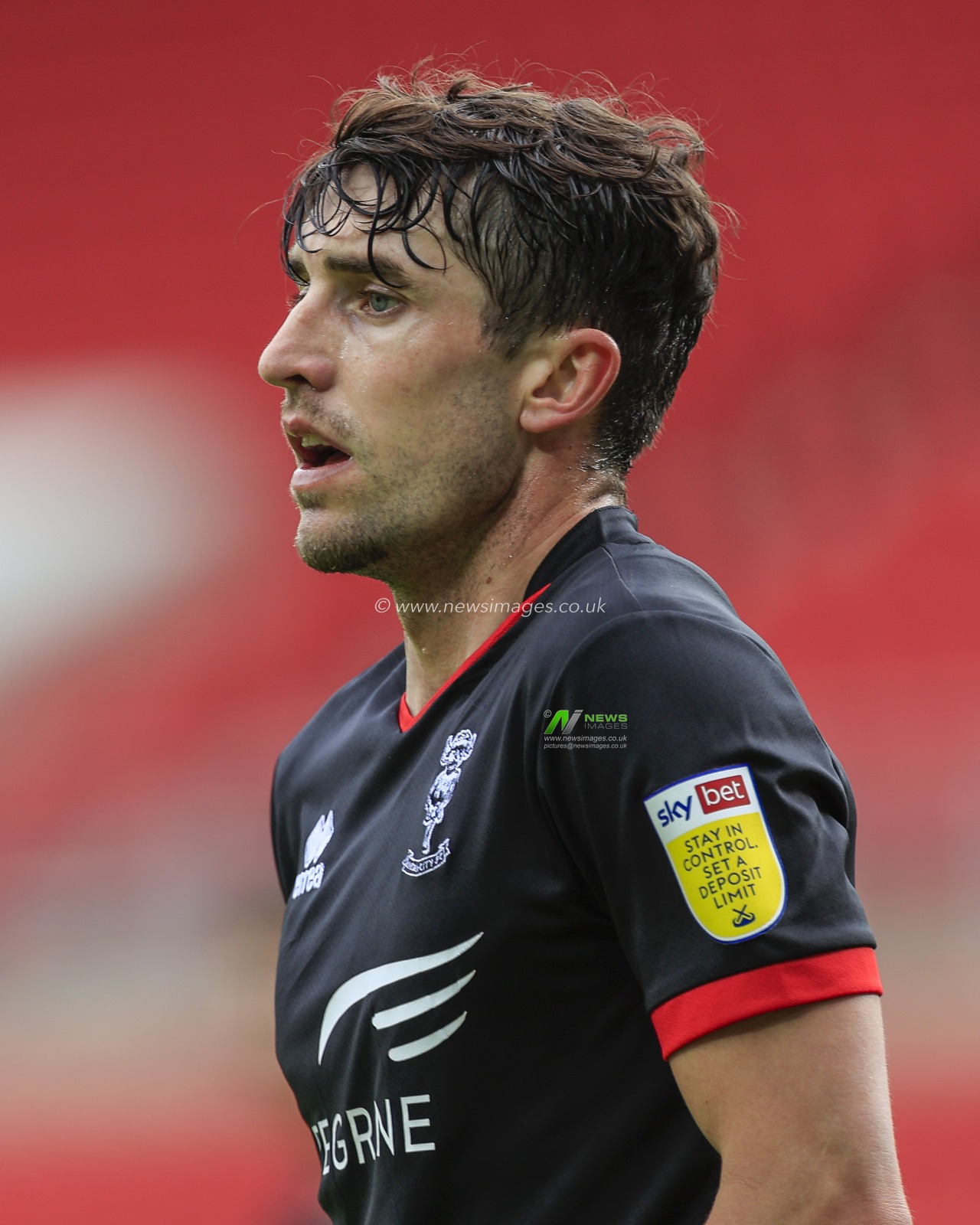 Joe Walsh #16 of Lincoln City during the game