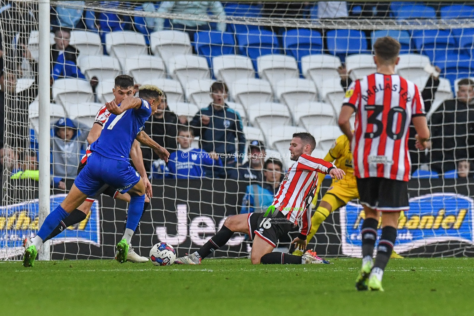 Oliver Norwood #16 of Sheffield United  blocks Callum Robinson #47 of Cardiff City shot at goal during the Sky Bet Championship match Cardiff City vs Sheffield United at Cardiff City Stadium, Cardiff, United Kingdom, 12th November 2022

(Photo by Mike Jones/News Images)