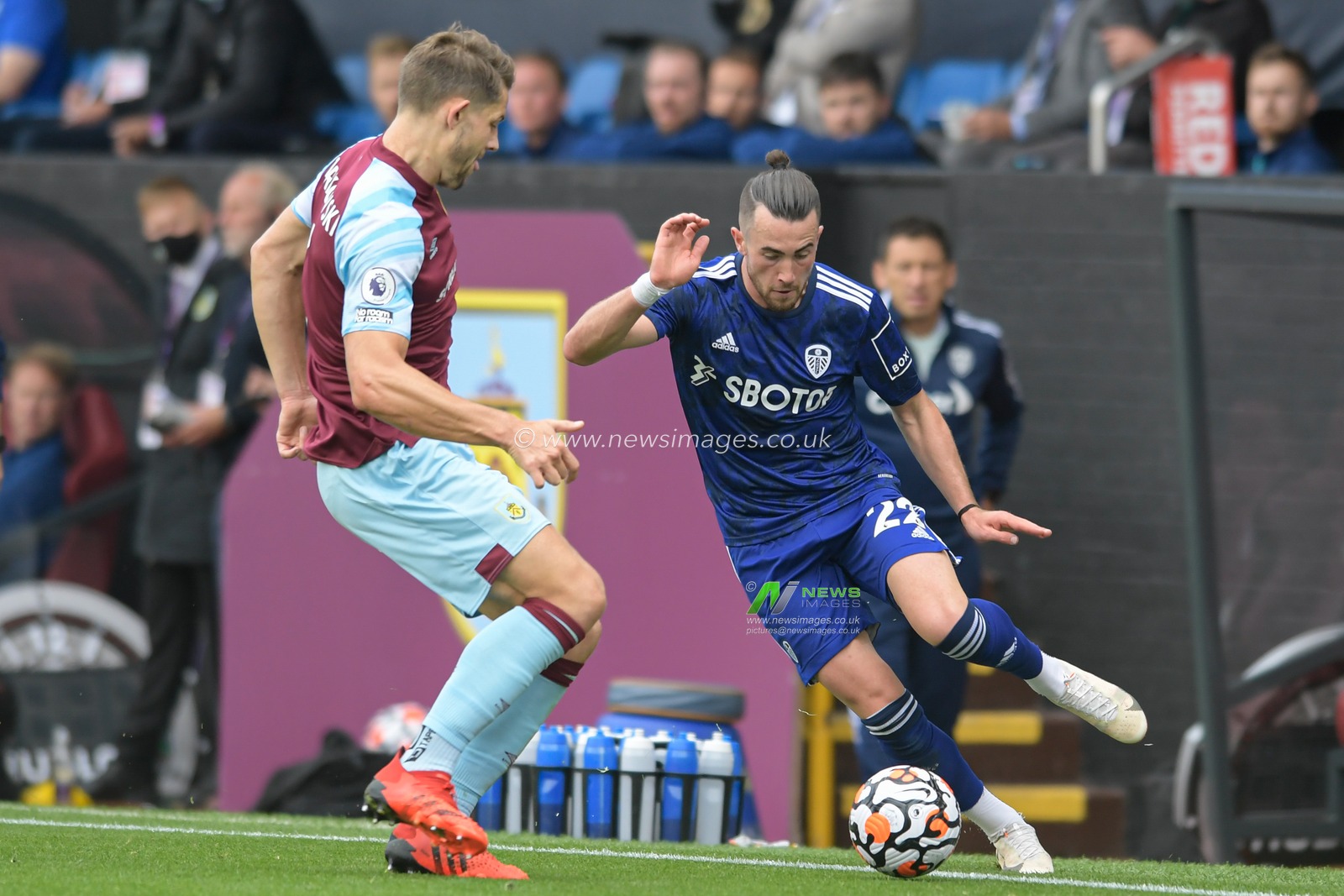 Jack Harrison #22 of Leeds United looks for a way past James Tarkowski #5 of Burnley