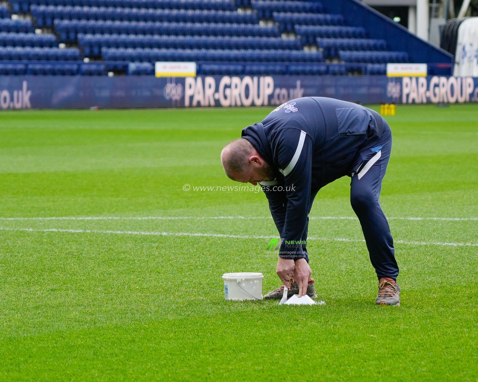 The Deepdale groundsman marks the penalty spot before the Emirates FA Cup match Preston North End vs Huddersfield Town at Deepdale, Preston, United Kingdom, 7th January 2023

(Photo by Steve Flynn/News Images)