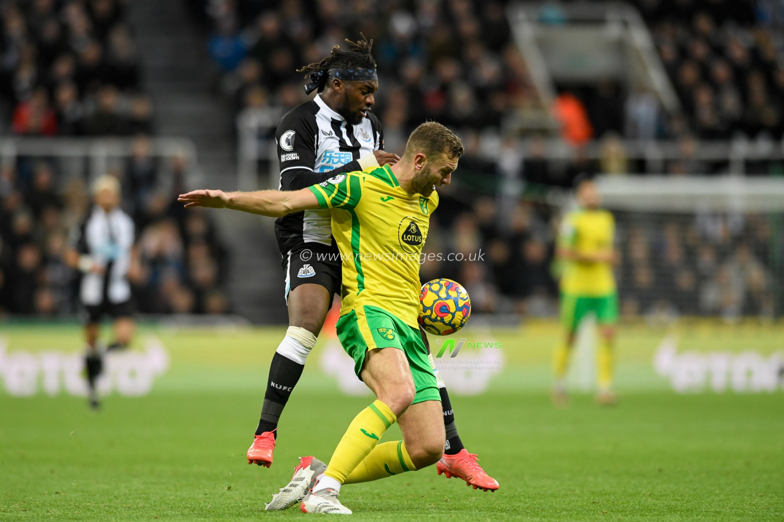 Allan Saint-Maximin #10 of Newcastle United fouls Ben Gibson #4 of Norwich City