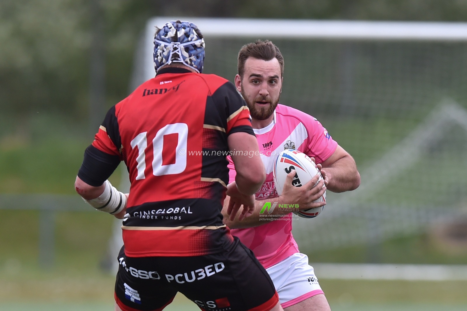 Chris Barratt of North Wales Crusaders  ahead of James Tyas of London Skolars