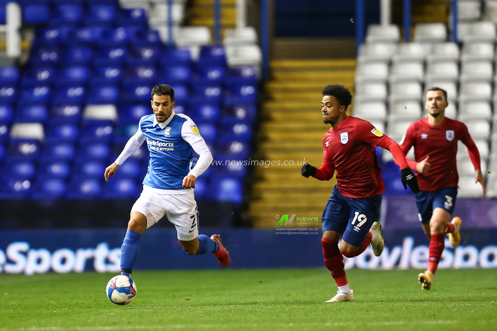 Maxime Colin (2) of Birmingham City is chased by Josh Koroma (19) of Huddersfield Town