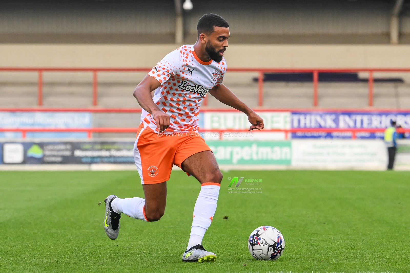 CJ Hamilton #22 of Blackpool makes a break with the ball  during the Pre-season friendly match Morecambe vs Blackpool at Mazuma Stadium, Morecambe, United Kingdom, 25th July 2023

(Photo by Craig Thomas/News Images)