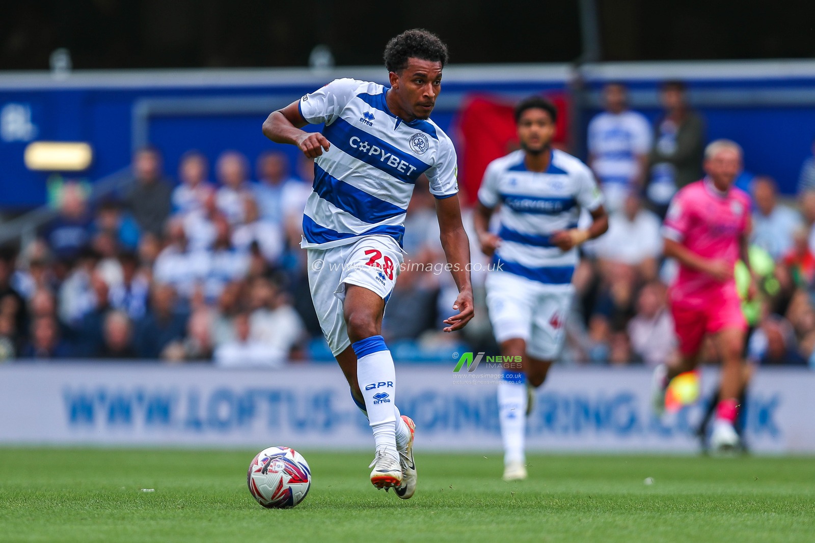 Alfie Lloyd of Queens Park Rangers runs with the ball during the Sky Bet Championship match Queens Park Rangers vs West Bromwich Albion at Kiyan Prince Foundation Stadium, London, United Kingdom, 10th August 2024

(Photo by Izzy Poles/News Images)