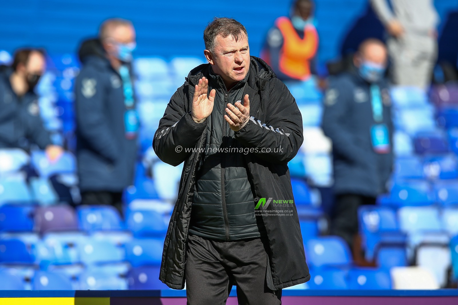 Mark Robins manager of Coventry City applauds his teams efforts at half time