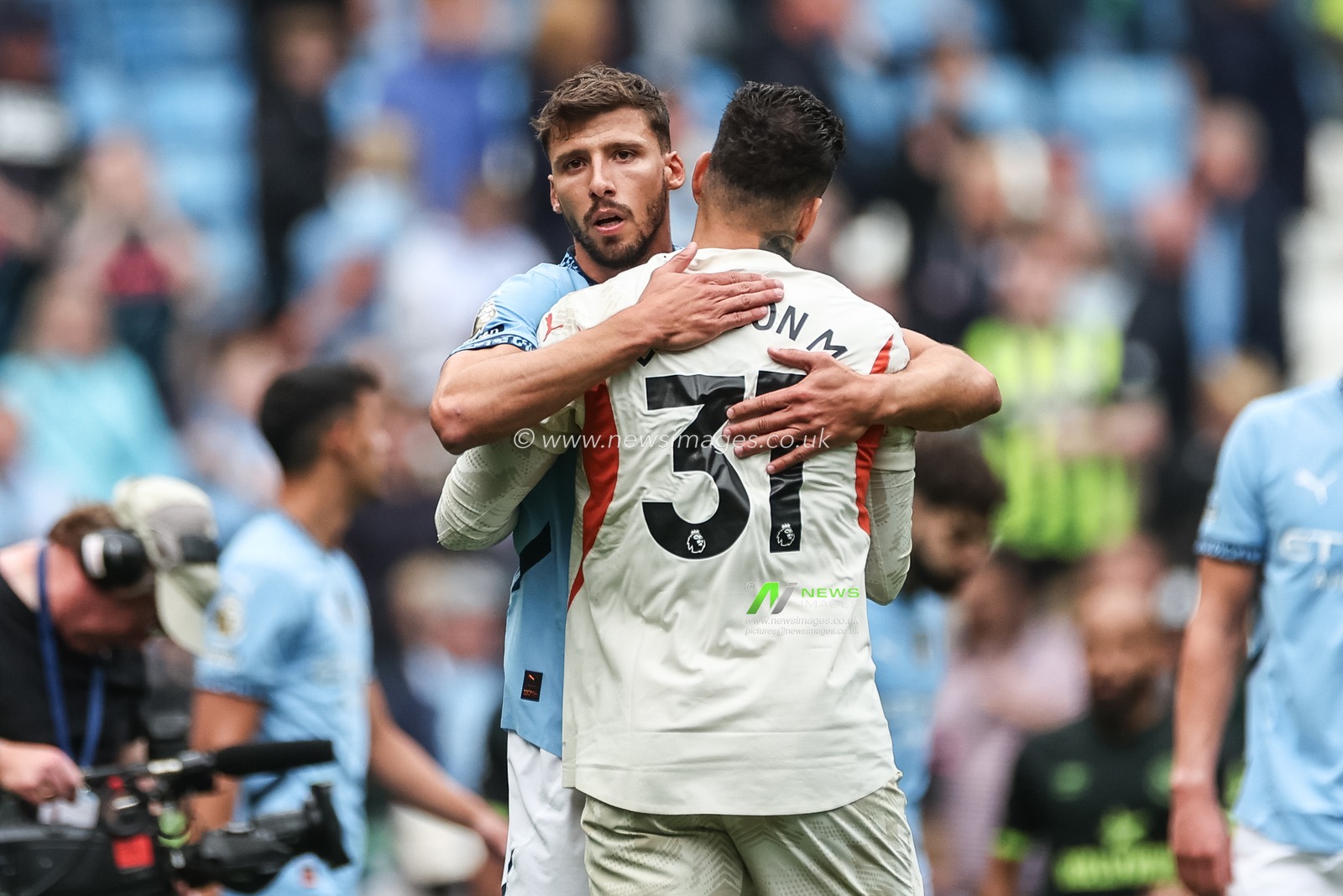 RÃºben Dias of Manchester City embraces Ederson of Manchester City during the Premier League match Manchester City vs Brentford at Etihad Stadium, Manchester, United Kingdom, 14th September 2024

(Photo by Mark Cosgrove/News Images)