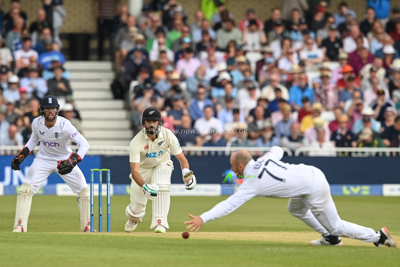 Jack Leach of England stops a shot from Daryl Mitchell of New Zealand during day 2 of the 2nd Test between the New Zealand Blackcaps and England at Trent Bridge Cricket Ground, Nottingham, England on Saturday 11 June 2022.